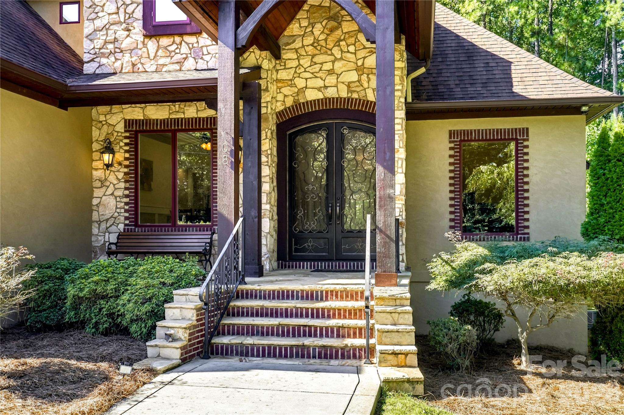 Custom 9' steel front entry doors with operating windows and natural flagstone porch - 108 Washam Road, Mooresville