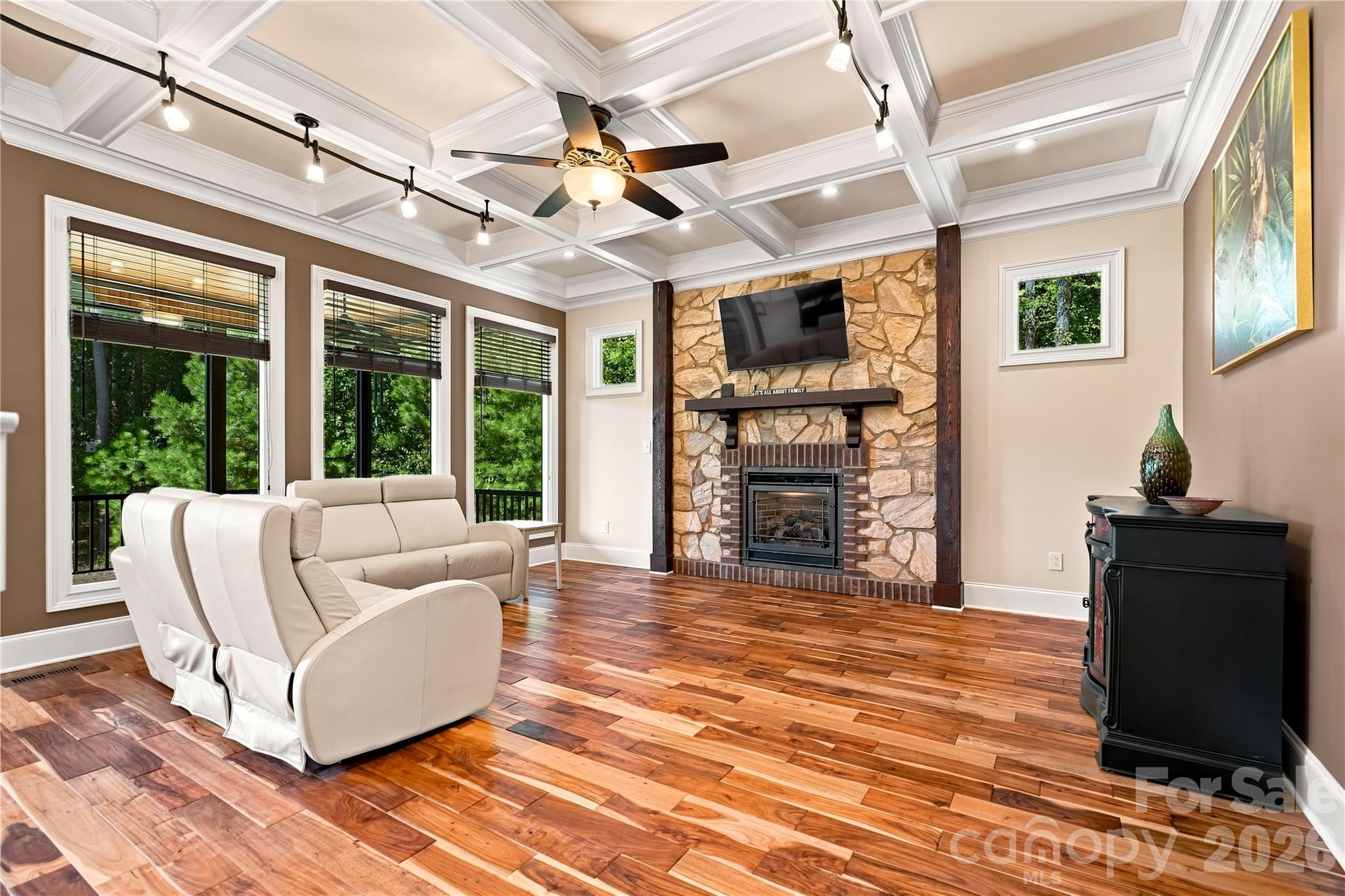 Living room with coffered ceiling and fireplace with TV that stays - 108 Washam Road, Mooresville