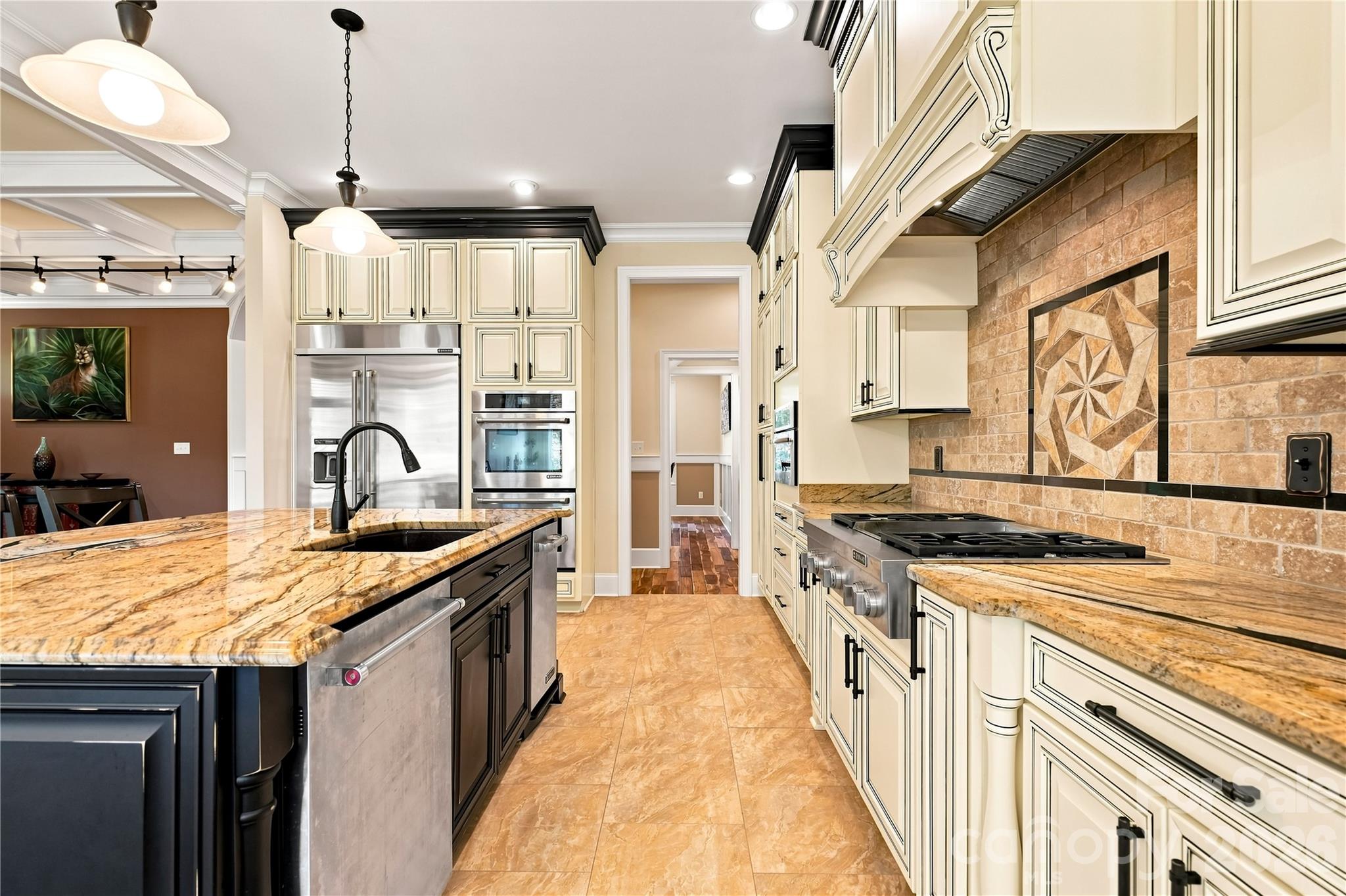 Huge center island and plenty of cabinet space. You'll love the double ovens. - 108 Washam Road, Mooresville