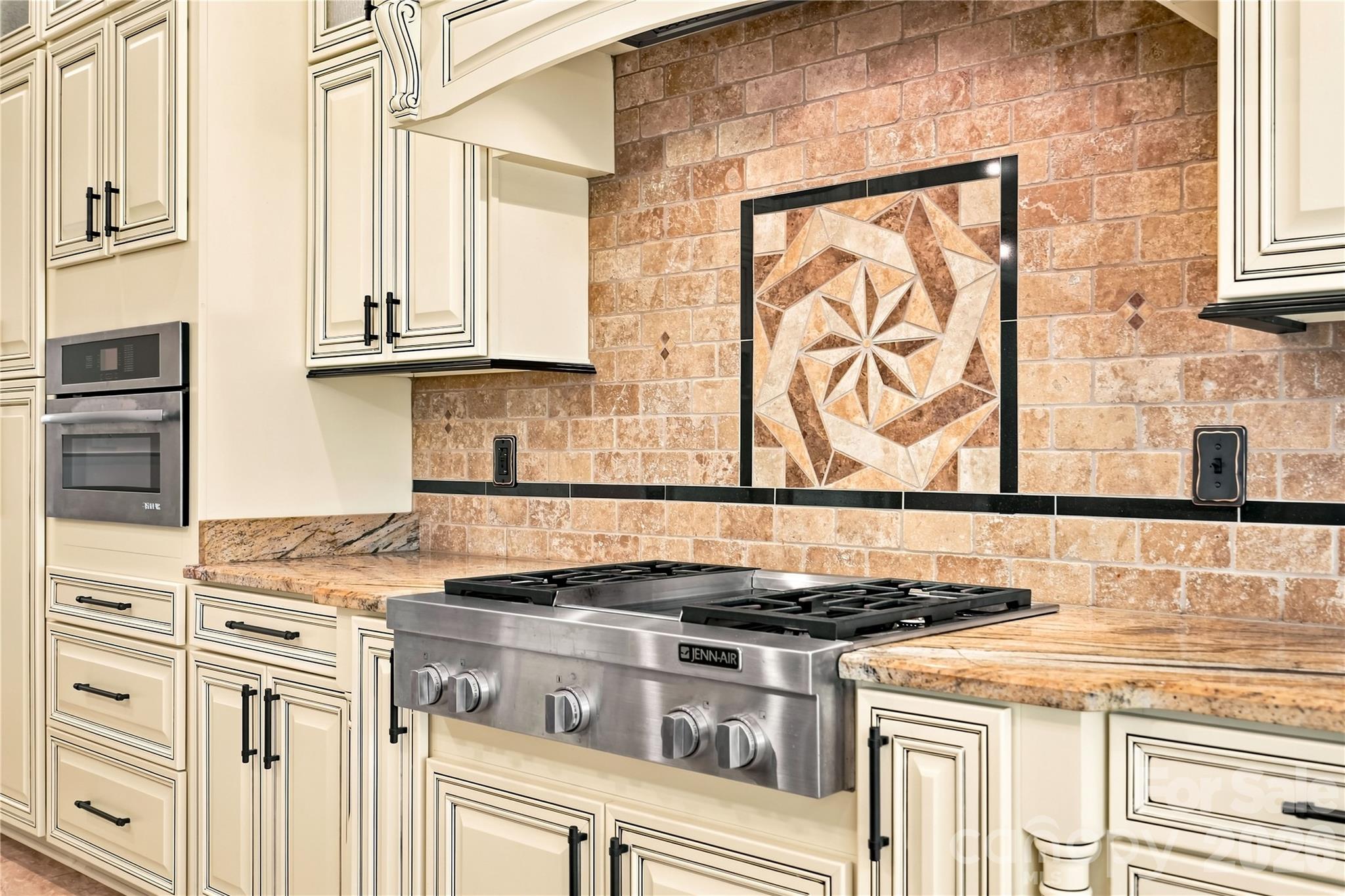 Lovely accent piece with gas stove, hood, and granite countertops - 108 Washam Road, Mooresville