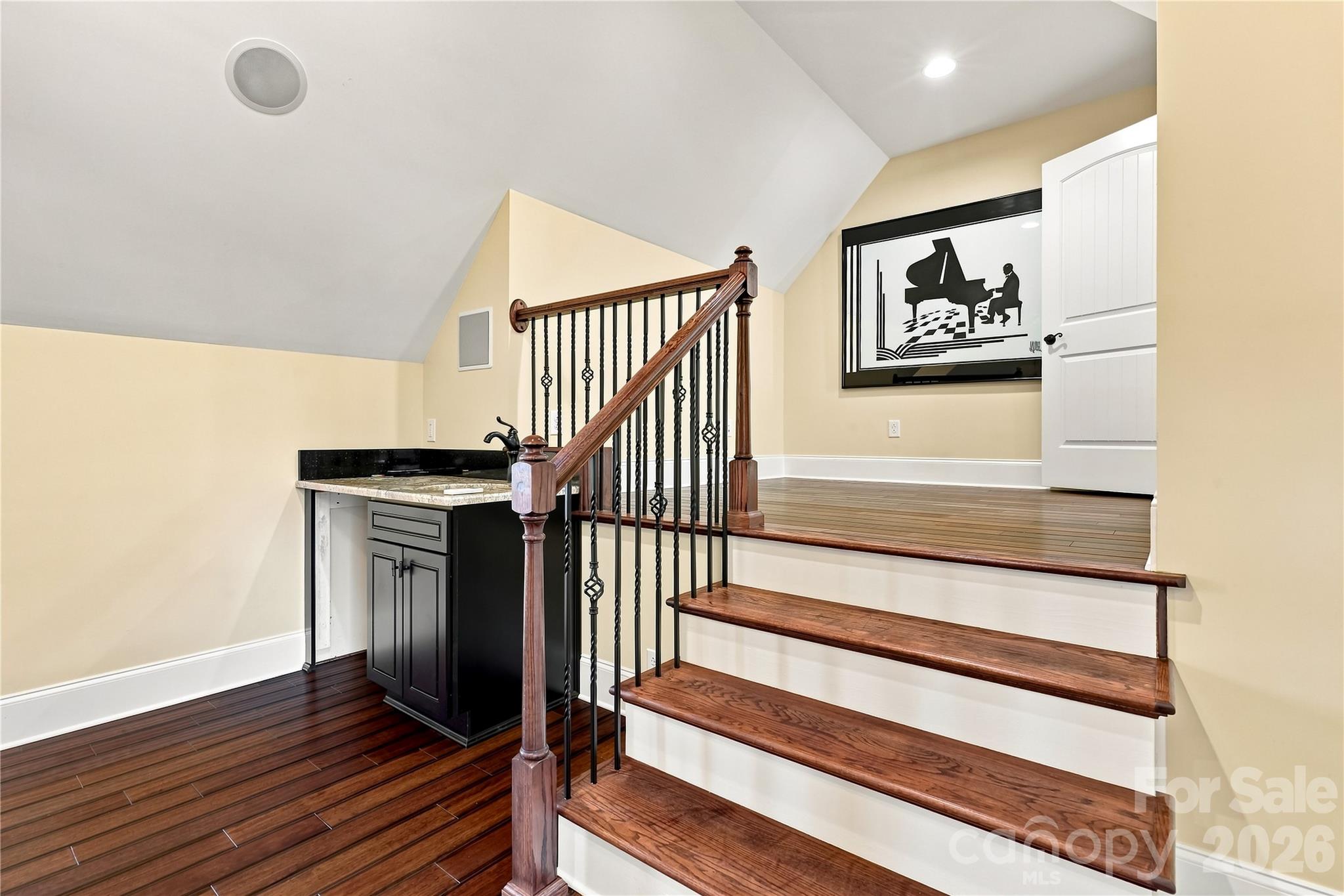 Steps down to the theatre room with a wet bar - 108 Washam Road, Mooresville