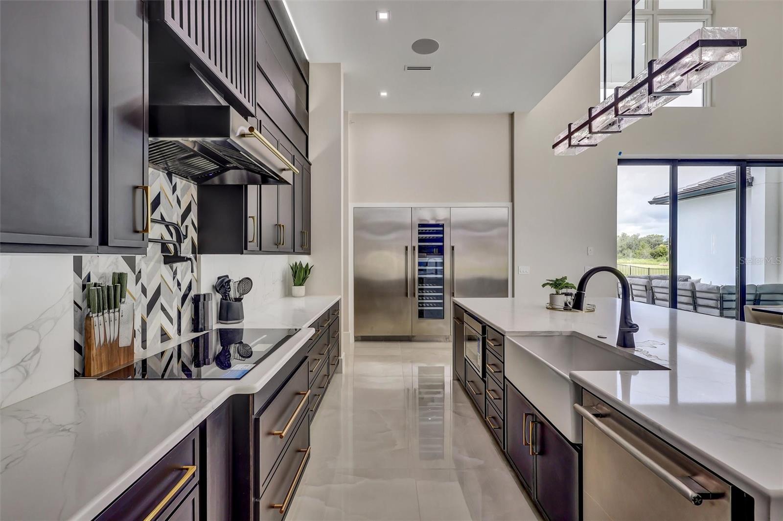 Beautifully appointed kitchen with abundant preparation and storage space. Thermador Appliances including a temperature controlled wine colum - 1002 COYOTE CREEK WAY, REUNION