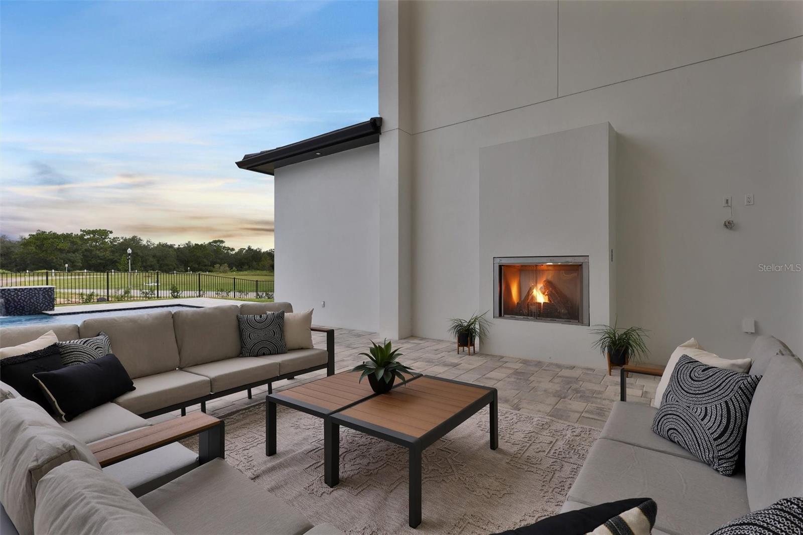Intimate fireside seating overlooking the pool and grounds - 1002 COYOTE CREEK WAY, REUNION