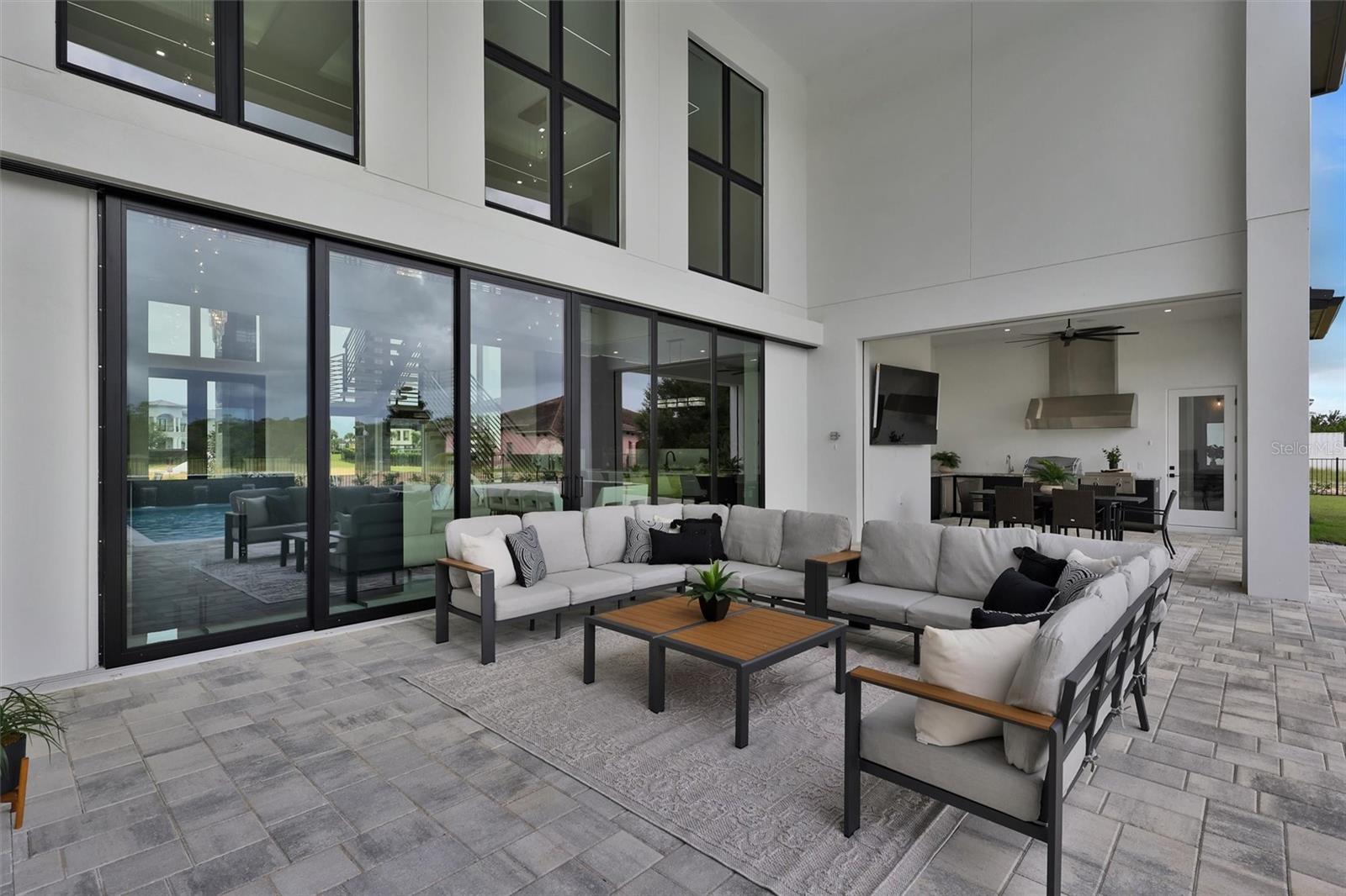 Covered lanai extends the home's living space outdoors - 1002 COYOTE CREEK WAY, REUNION