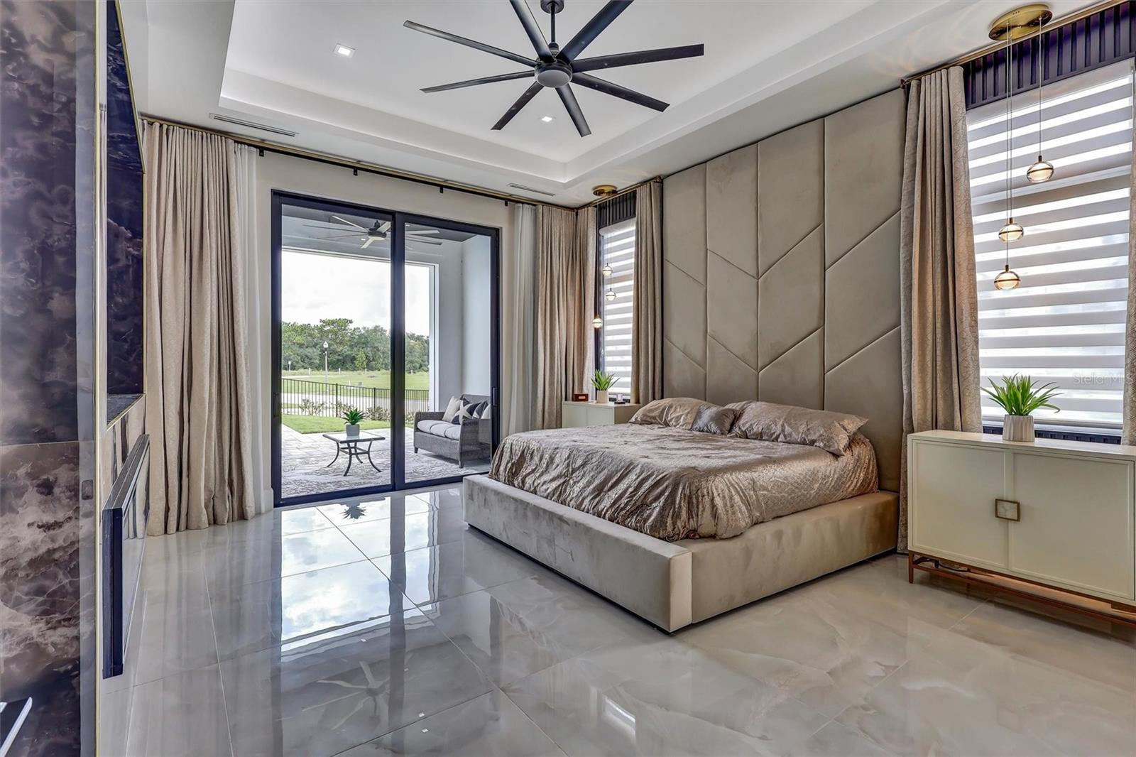 First-floor primary suite with custom built bed with direct access to its private outdoor retreat - 1002 COYOTE CREEK WAY, REUNION