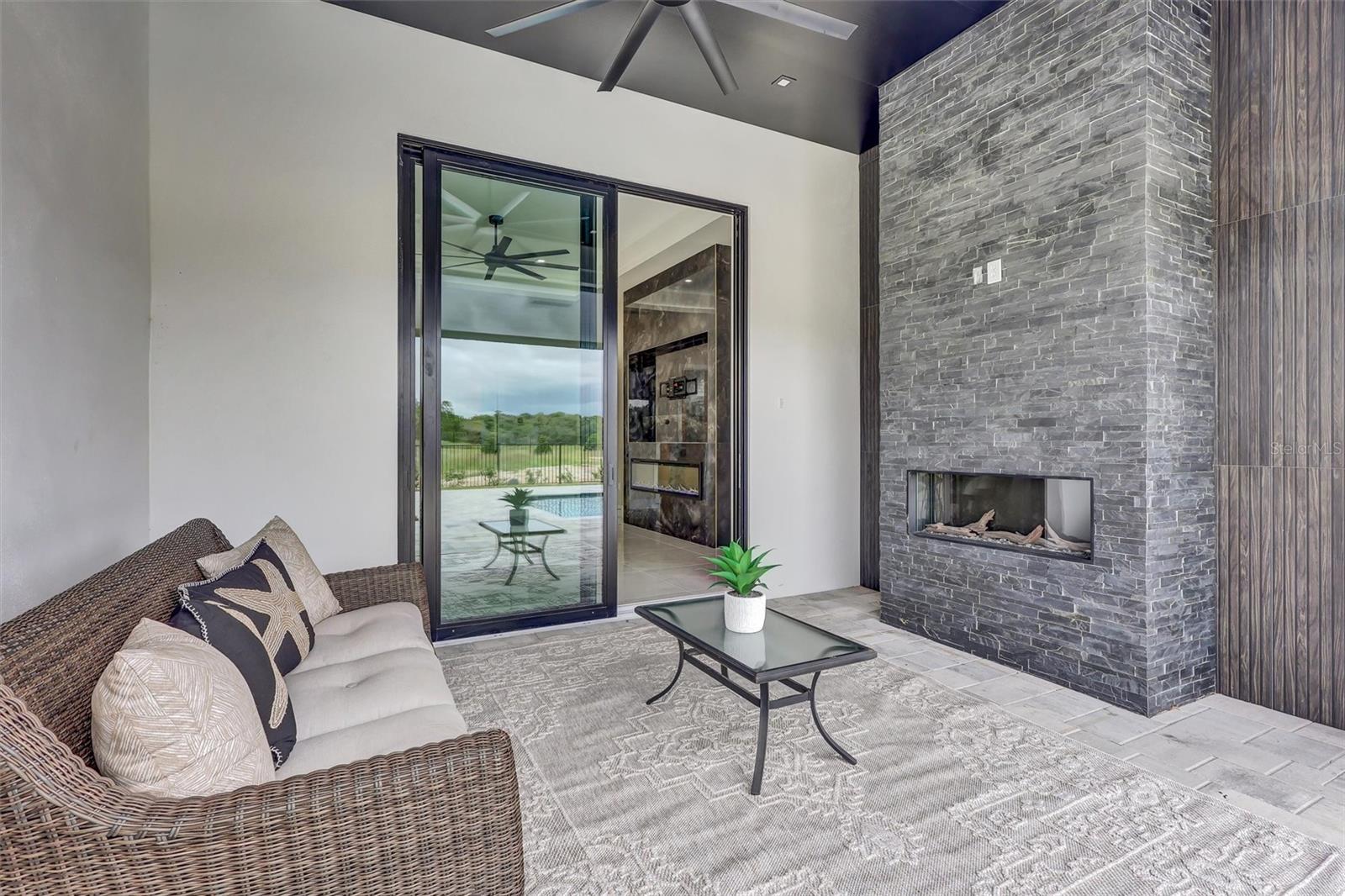Primary retreat with fireplace and views toward the pool. Just add TV. - 1002 COYOTE CREEK WAY, REUNION