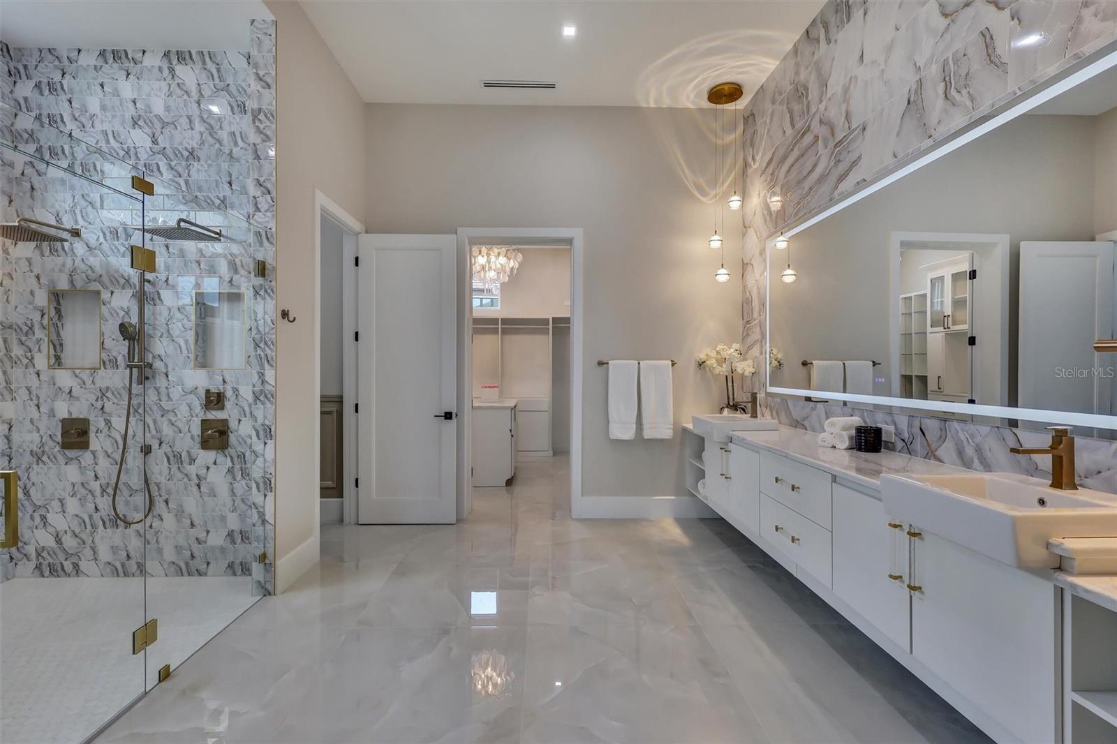 Spa-inspired primary bath with dual vanities and dramatic wet room - 1002 COYOTE CREEK WAY, REUNION