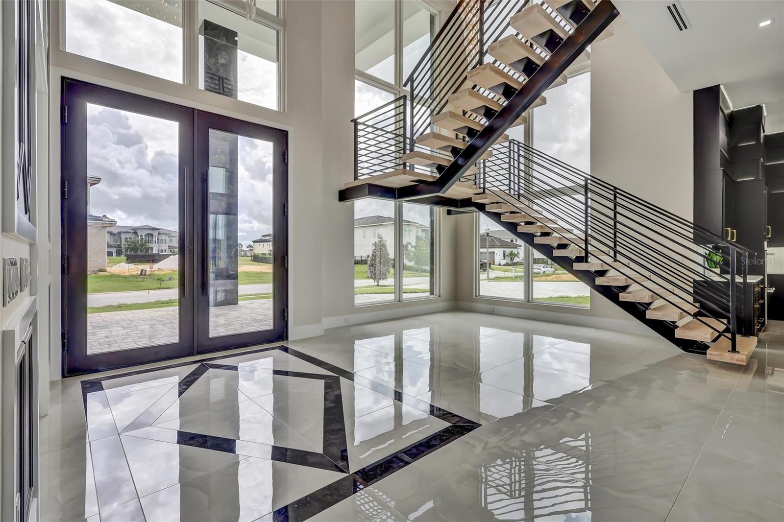 Impressive foyer with soaring glass and architectural floating staircase - 1002 COYOTE CREEK WAY, REUNION