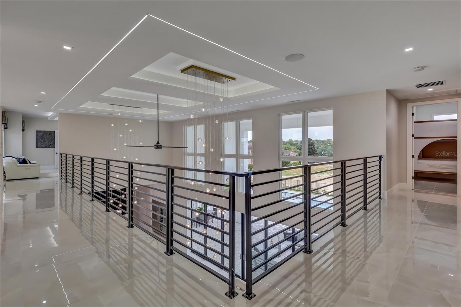 Open upper gallery connects the second-floor living spaces - 1002 COYOTE CREEK WAY, REUNION