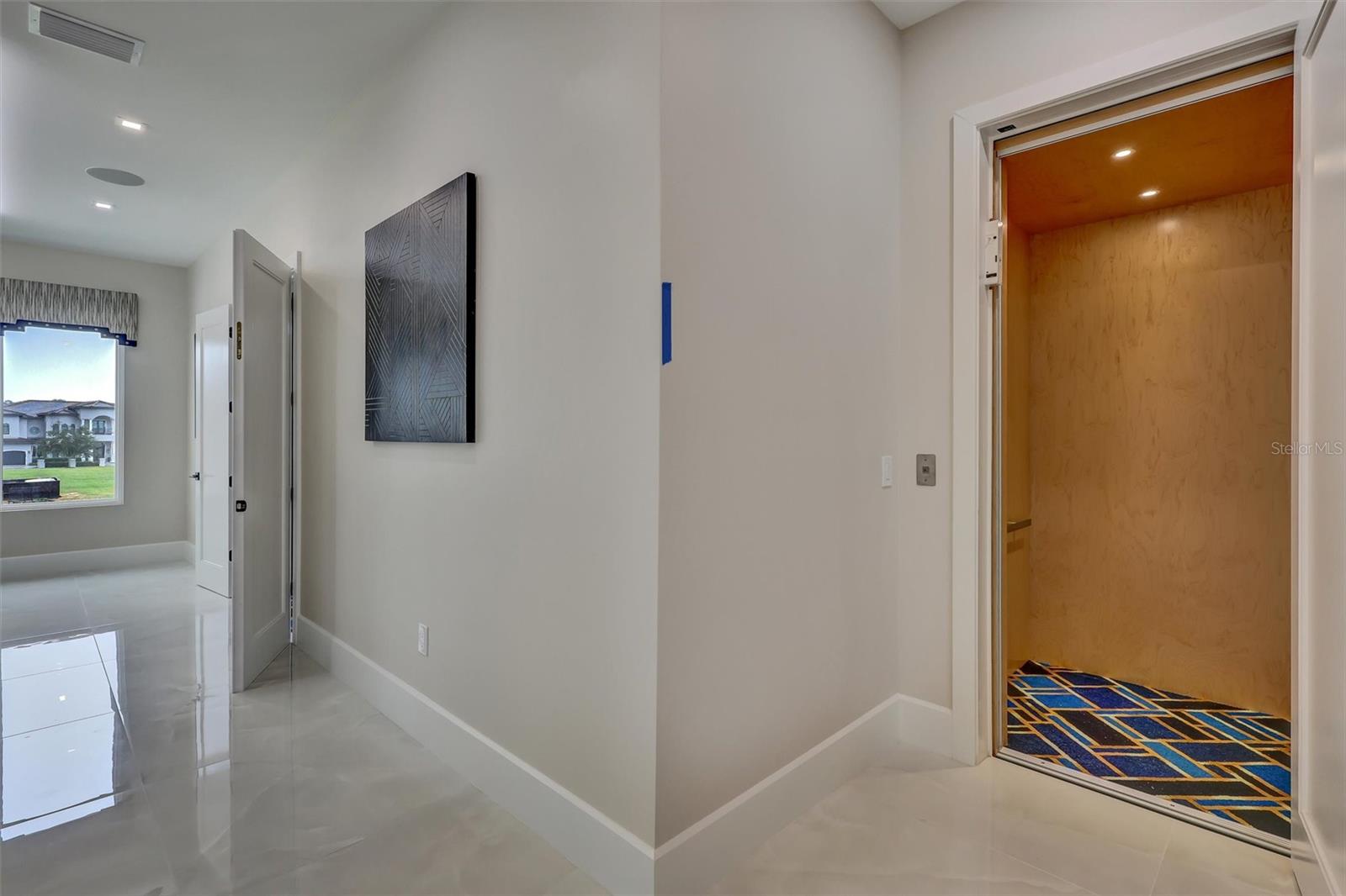 rivate residential elevator provides convenient access between levels - 1002 COYOTE CREEK WAY, REUNION
