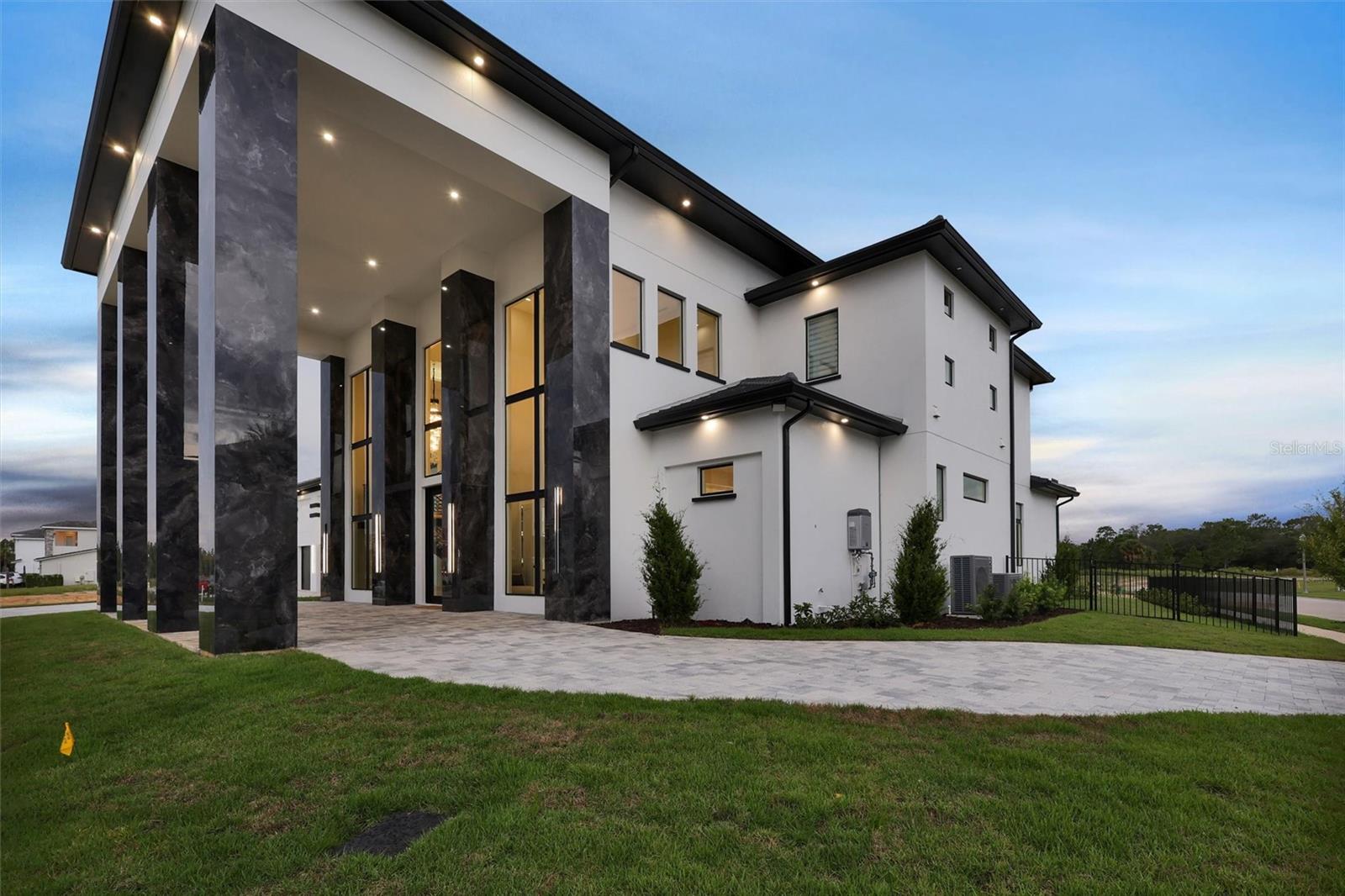 Architectural columns, floor-to-ceiling glass and designer lighting make a dramatic statement - 1002 COYOTE CREEK WAY, REUNION