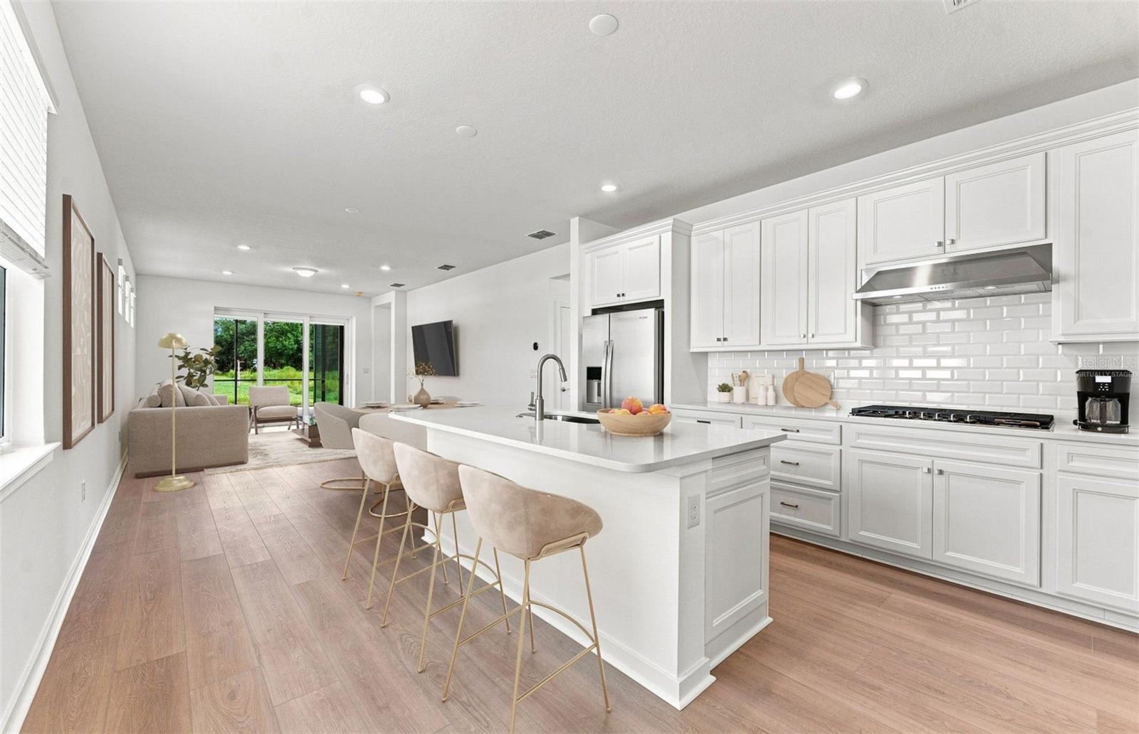 Virtually Staged - Open Kitchen to Cafe to Gathering Room - 14753 SUNLIT CIR, PARRISH