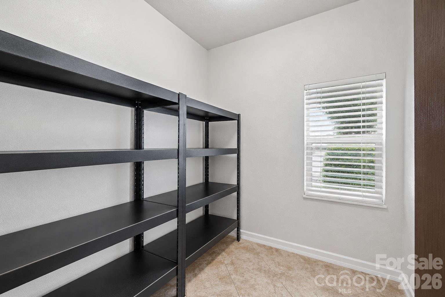 Huge walk-in pantry offers abundant storage and plumbed for a sink or additional laundry area. Photo enhanced for visual clarity and spatial context. - 329 Farm Springs Drive, Mount Holly