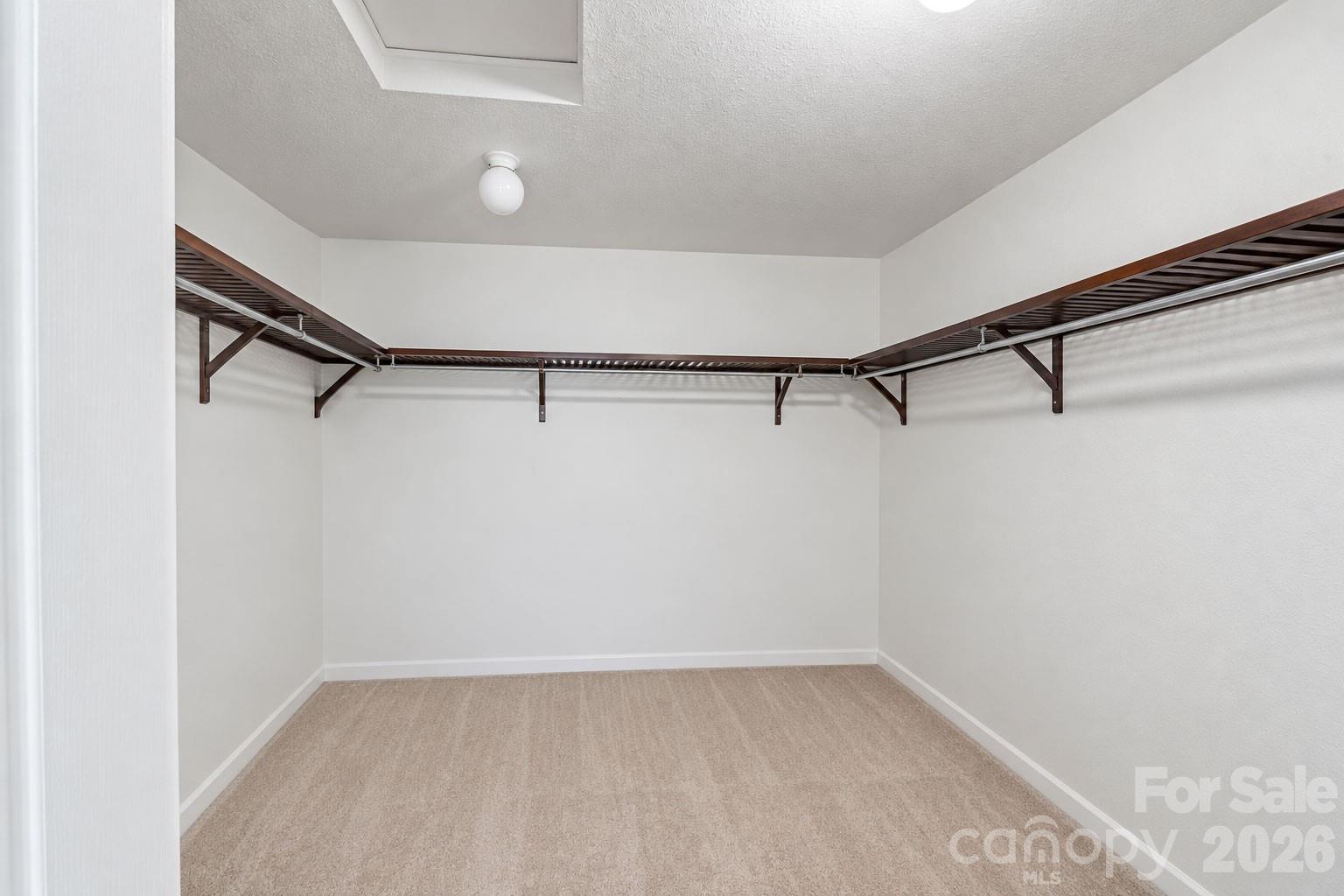 Large walk-in closet. Photo enhanced for visual clarity and spatial context. - 329 Farm Springs Drive, Mount Holly