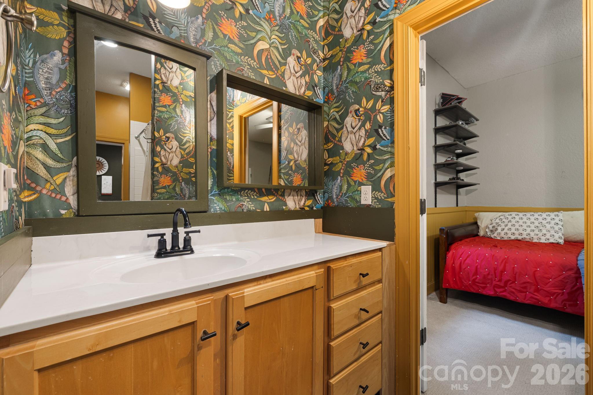 Jack and Jill bathroom connecting bedroom 2 + 3. - 312 E Forest Place, Candler