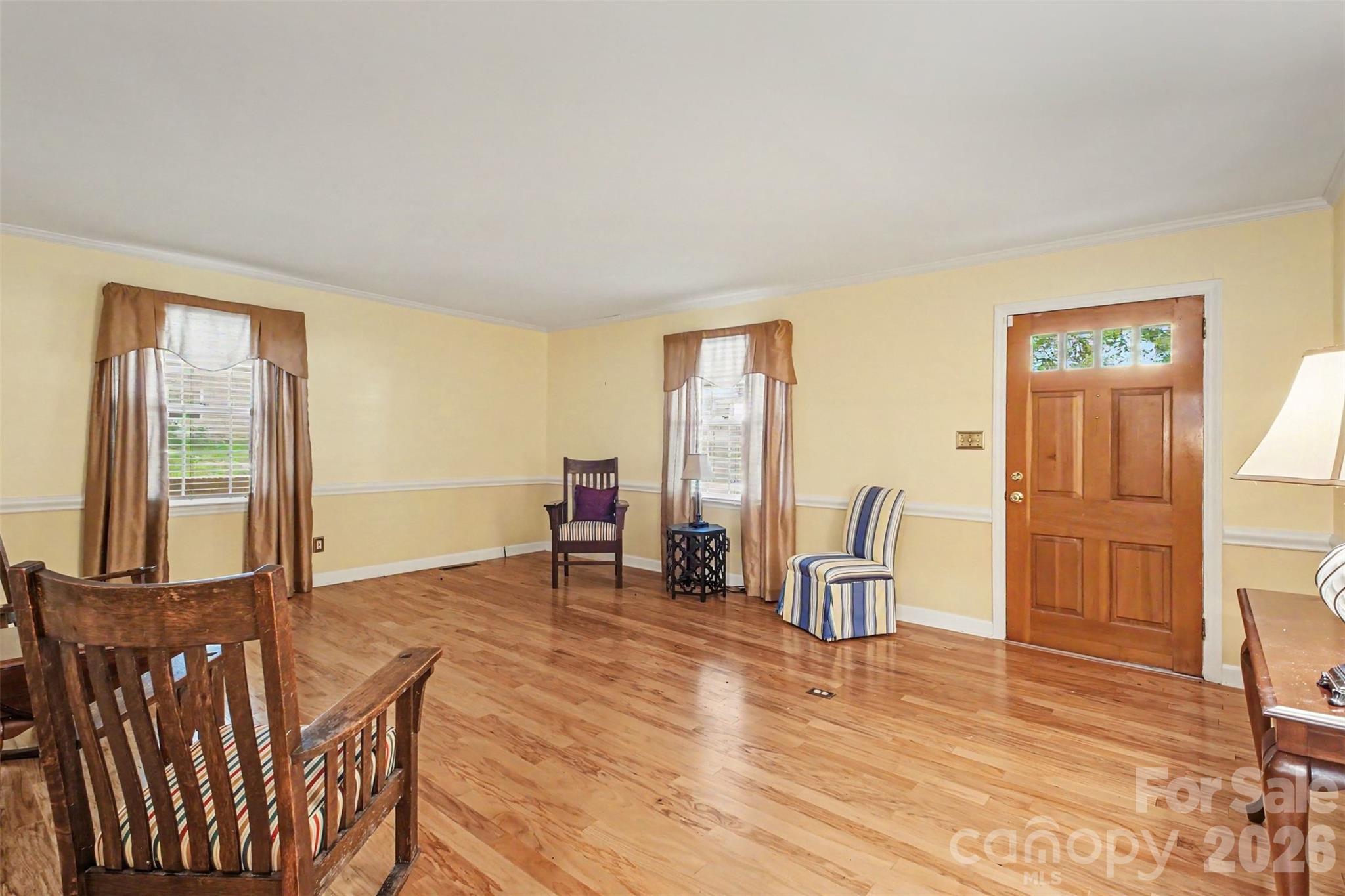 The spacious Living Room boast beautiful hardwood floors and chair moulding - 113 Brookshire Avenue, Kannapolis