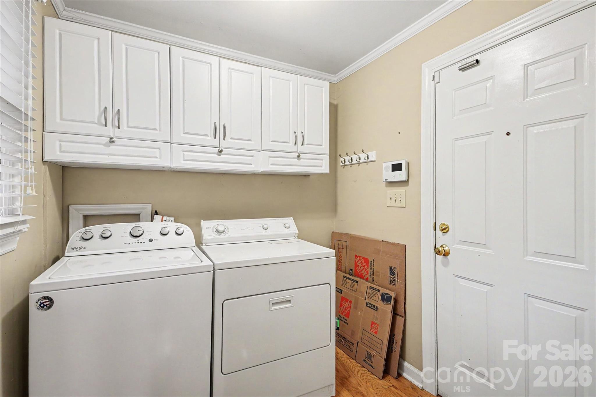 Yes it has a Laundry Room right off the Dining Room and Carport Entry. Washer and Dryer does convey - 113 Brookshire Avenue, Kannapolis