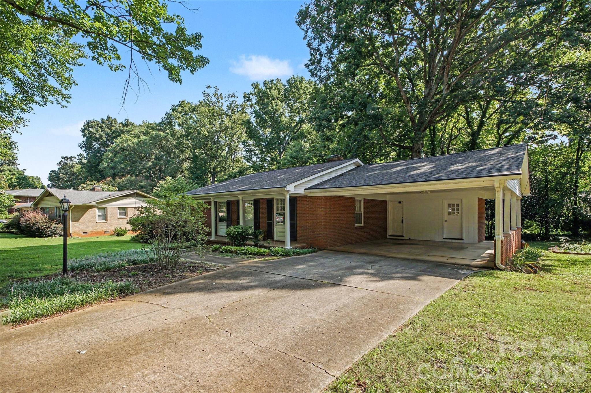Offering Lots of Parking Spaces for Family and Friends. The Carport features an utility area for extra storage - 113 Brookshire Avenue, Kannapolis