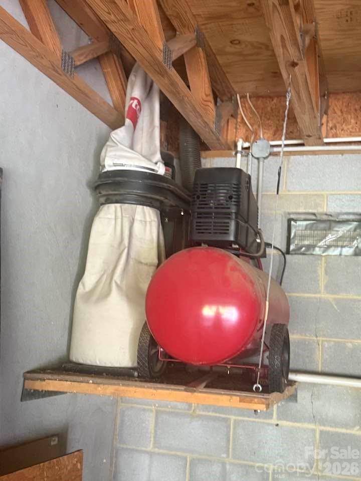 Air compressor and dust collection system in lower garage, for use in overhead workshop - 977 Morning Ride Drive, Columbus
