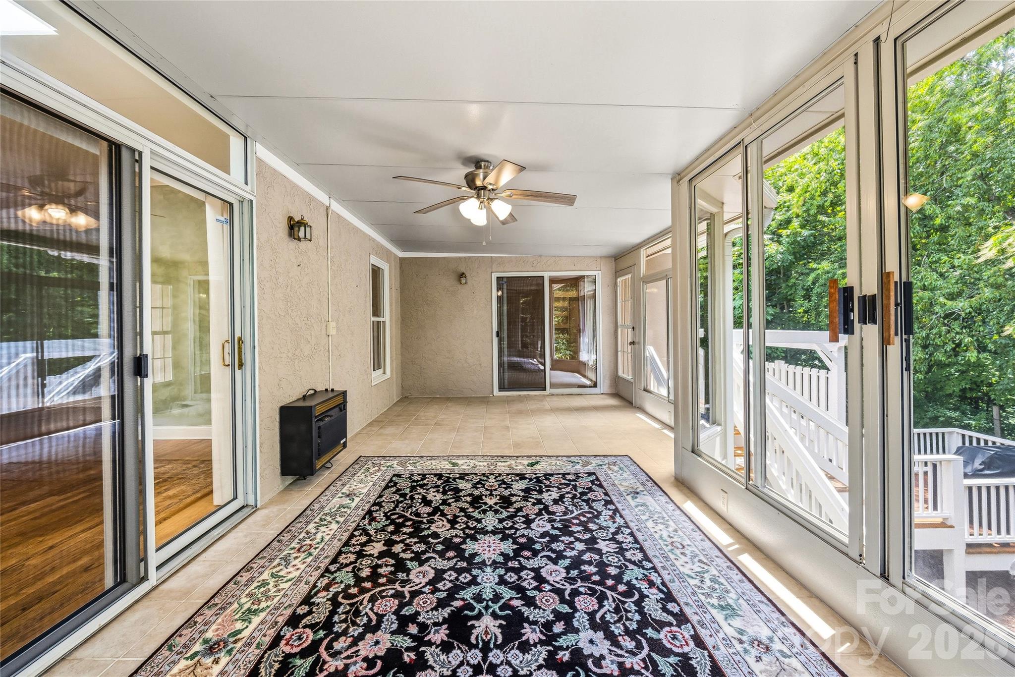 Sunroom overlooking the backyard. - 200 Teaberry Lane, Hendersonville