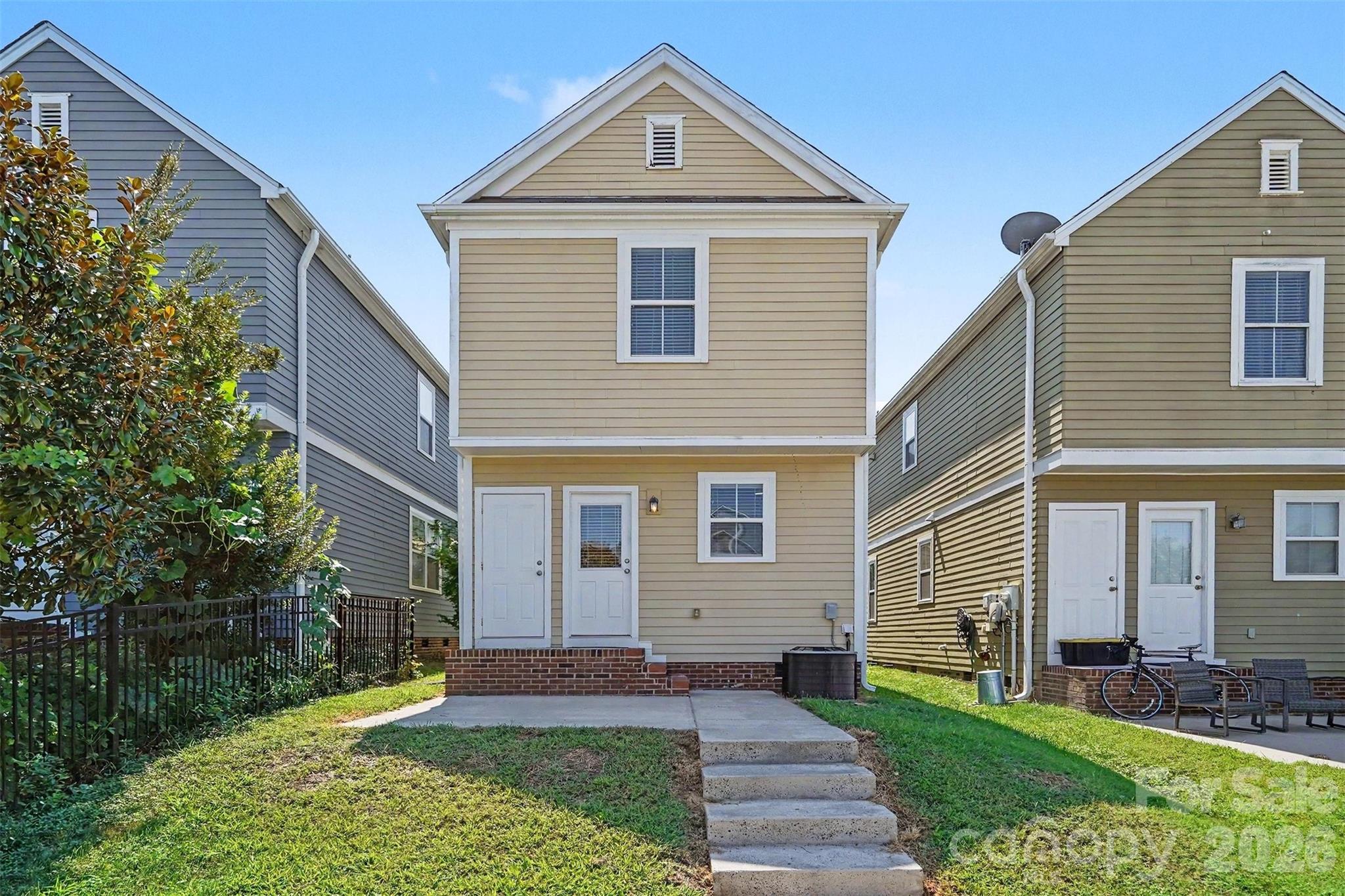 Back Alley view with 2 parking spaces in driveway. Storage closet as well. - 13913 Helen Benson Boulevard, Davidson