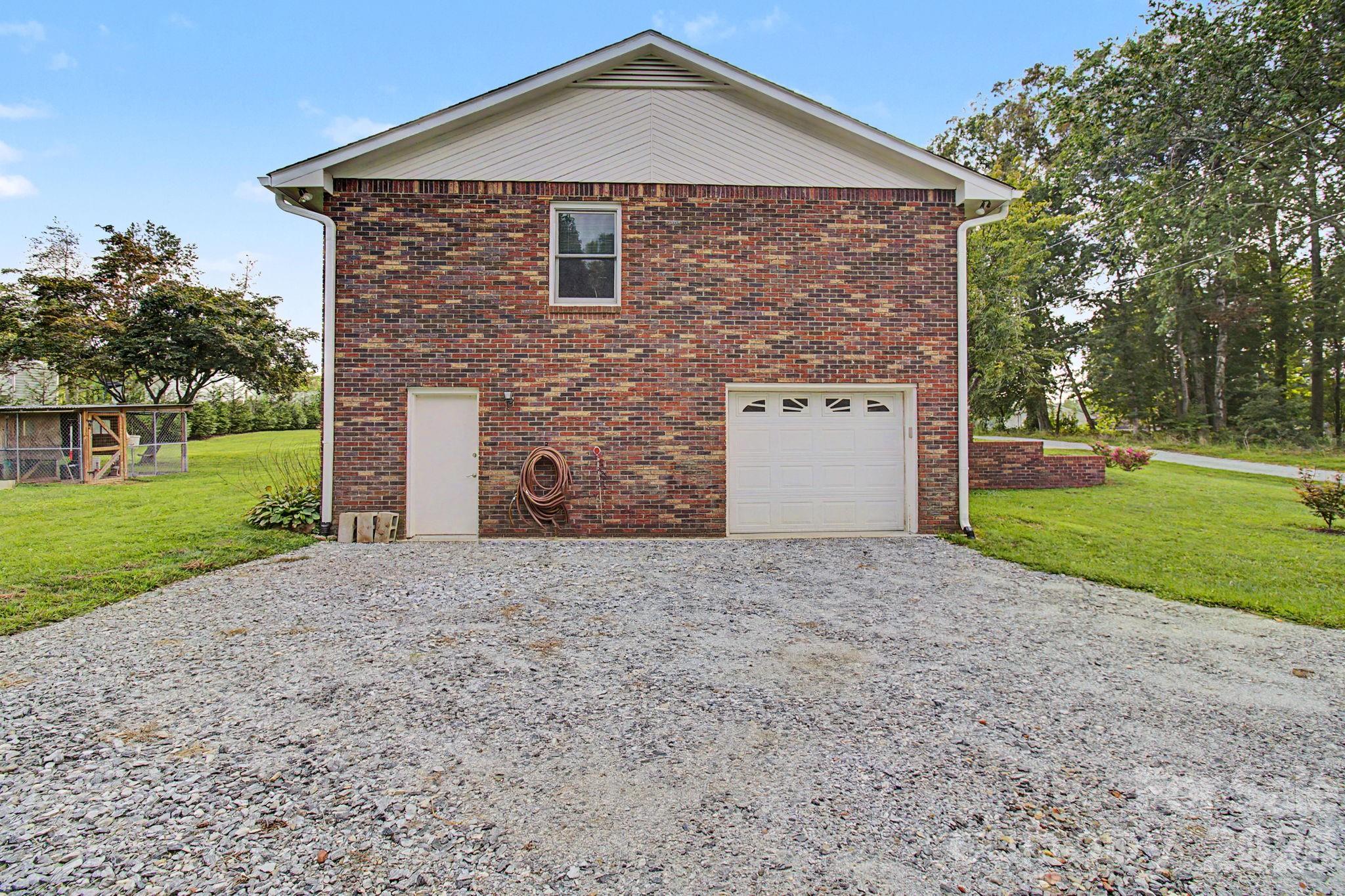 Side Garage with Door Entry - 230 Blythewood Drive, Hendersonville
