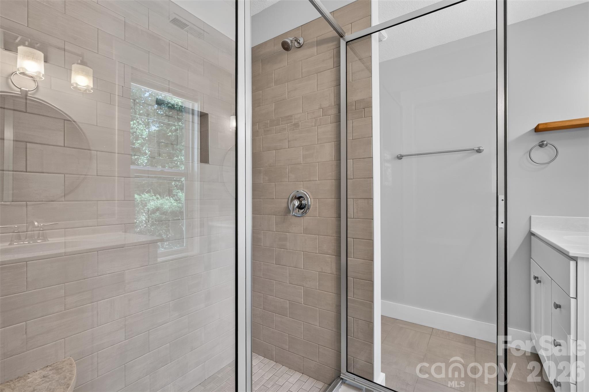Large tiled shower in primary bathroom - 134 Shelburne Road, Asheville
