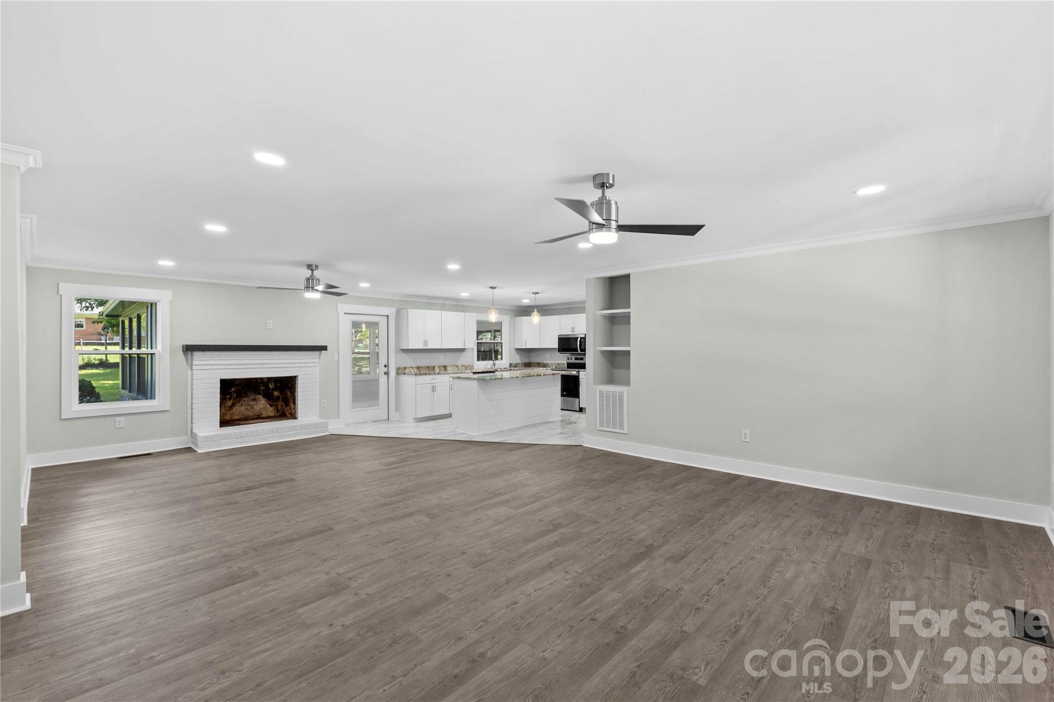 Great room with luxury vinyl plank flooring - 614 S Magnolia Street, Mooresville