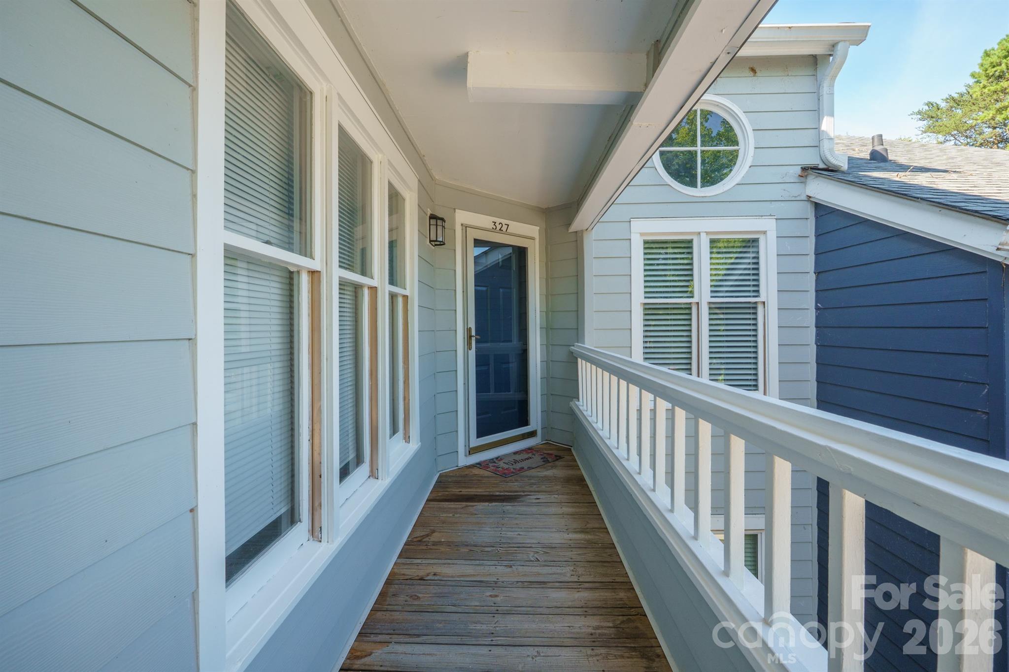 Front entrance with glass storm door - 327 Northwest Drive, Davidson