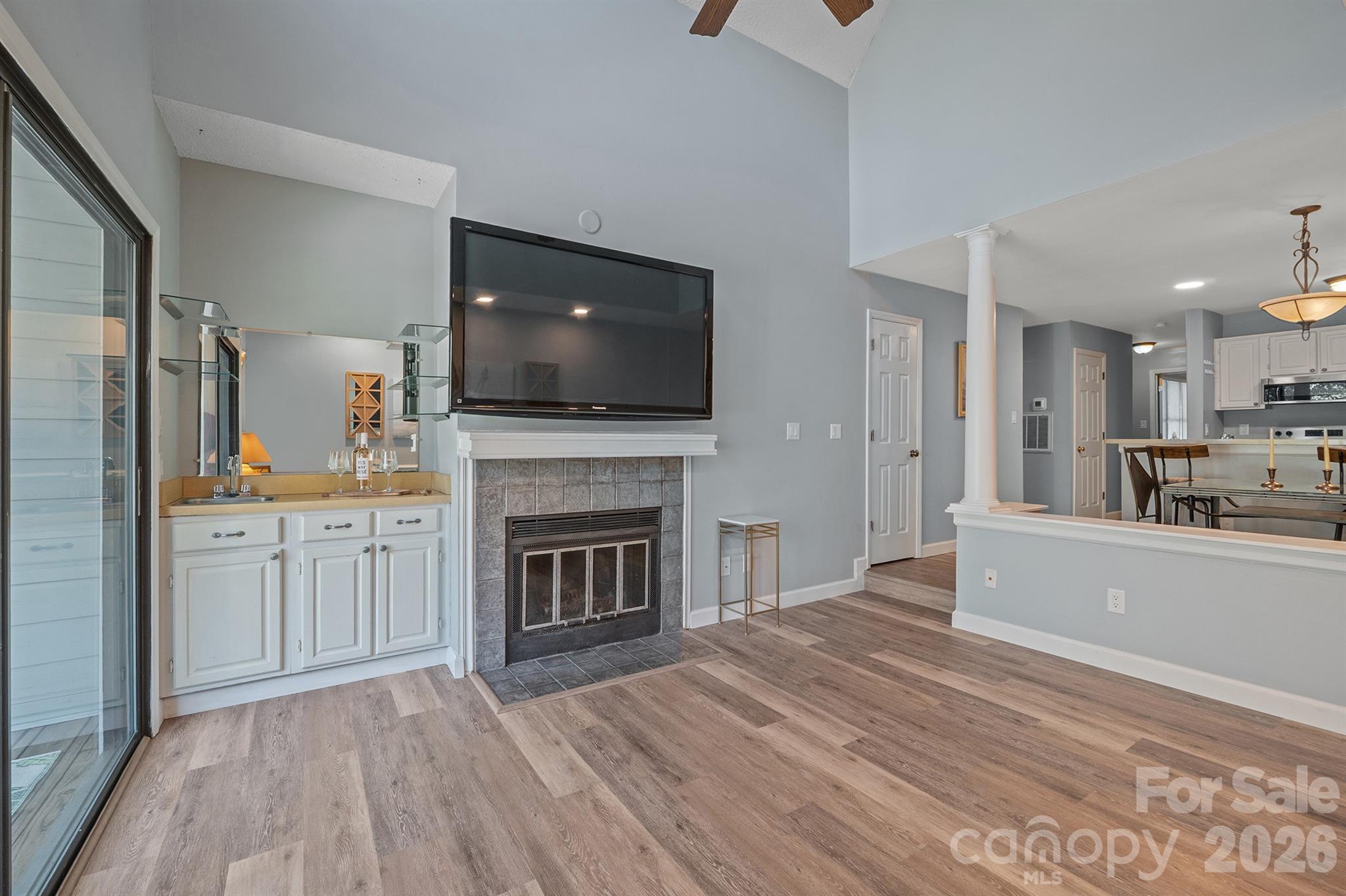 Wet bar shown here with shelving and your fireplace - 327 Northwest Drive, Davidson