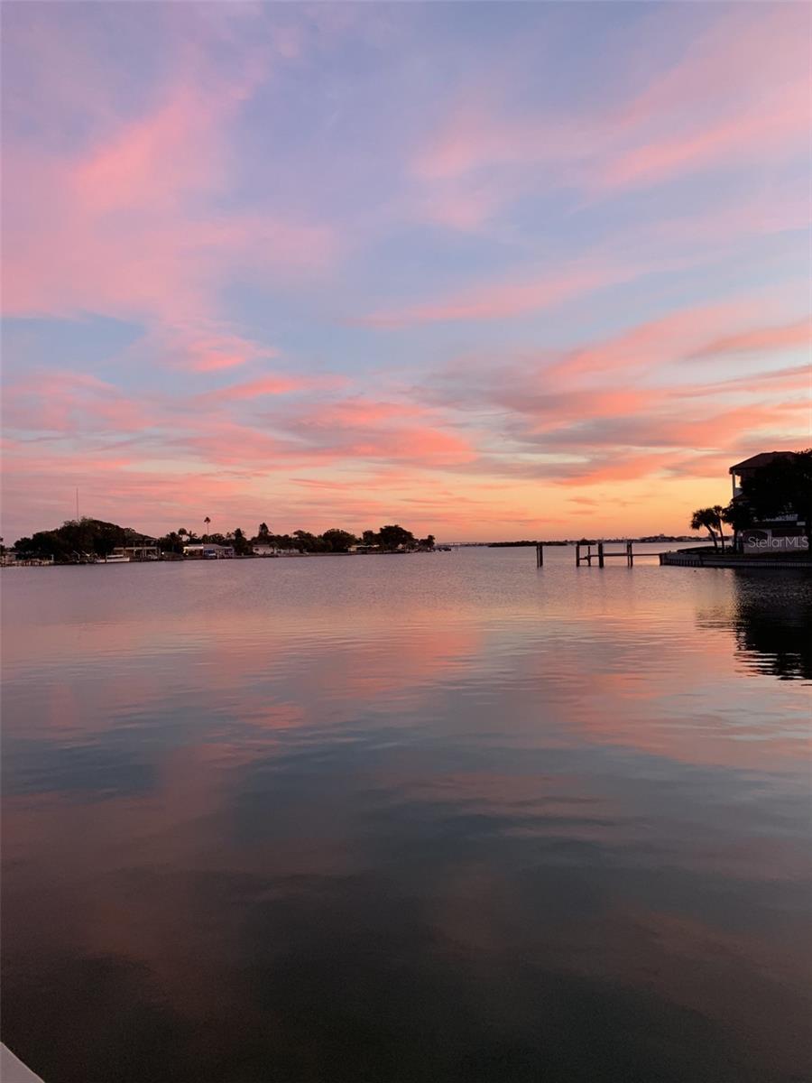 Expansive waterfront vistas create a spectacular backdrop for colorful Florida sunsets over Boca Ciega Bay. - 6505 DEBBIE LN S, ST PETERSBURG