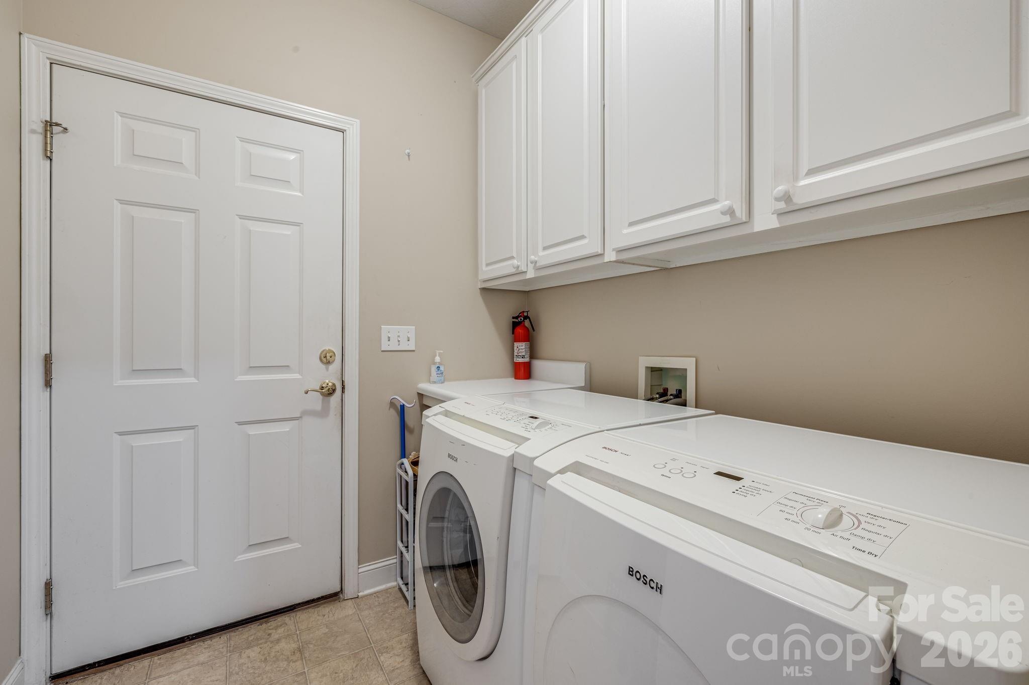 Laundry room with access to the garage. - 212 Carriage Springs Way, Hendersonville