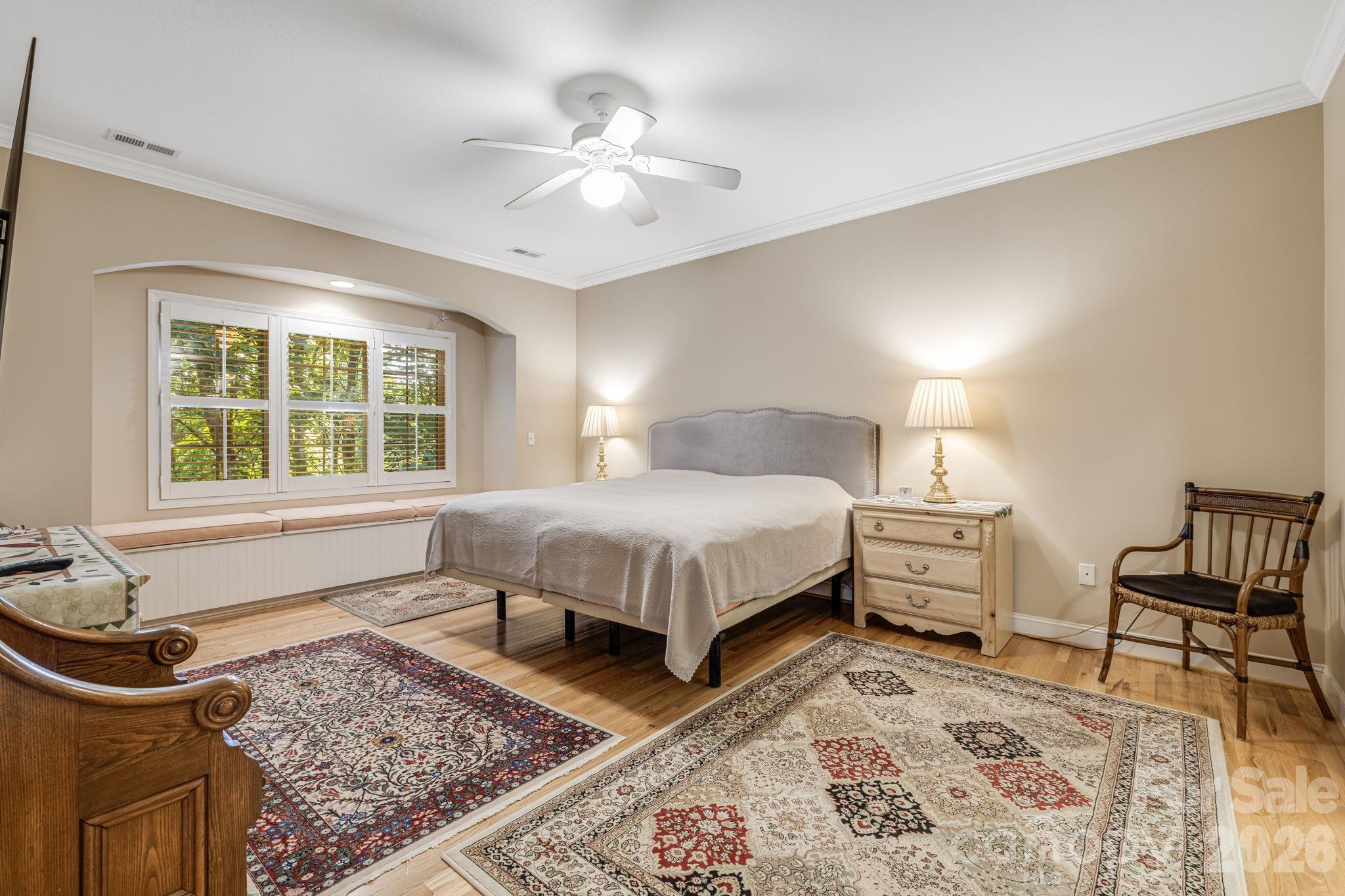 Primary bedroom with window seat. - 212 Carriage Springs Way, Hendersonville