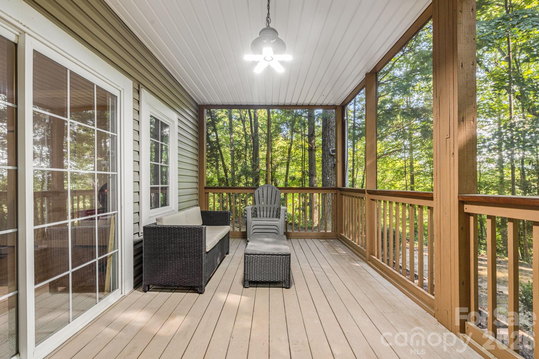Screened deck on lower level. - 212 Carriage Springs Way, Hendersonville