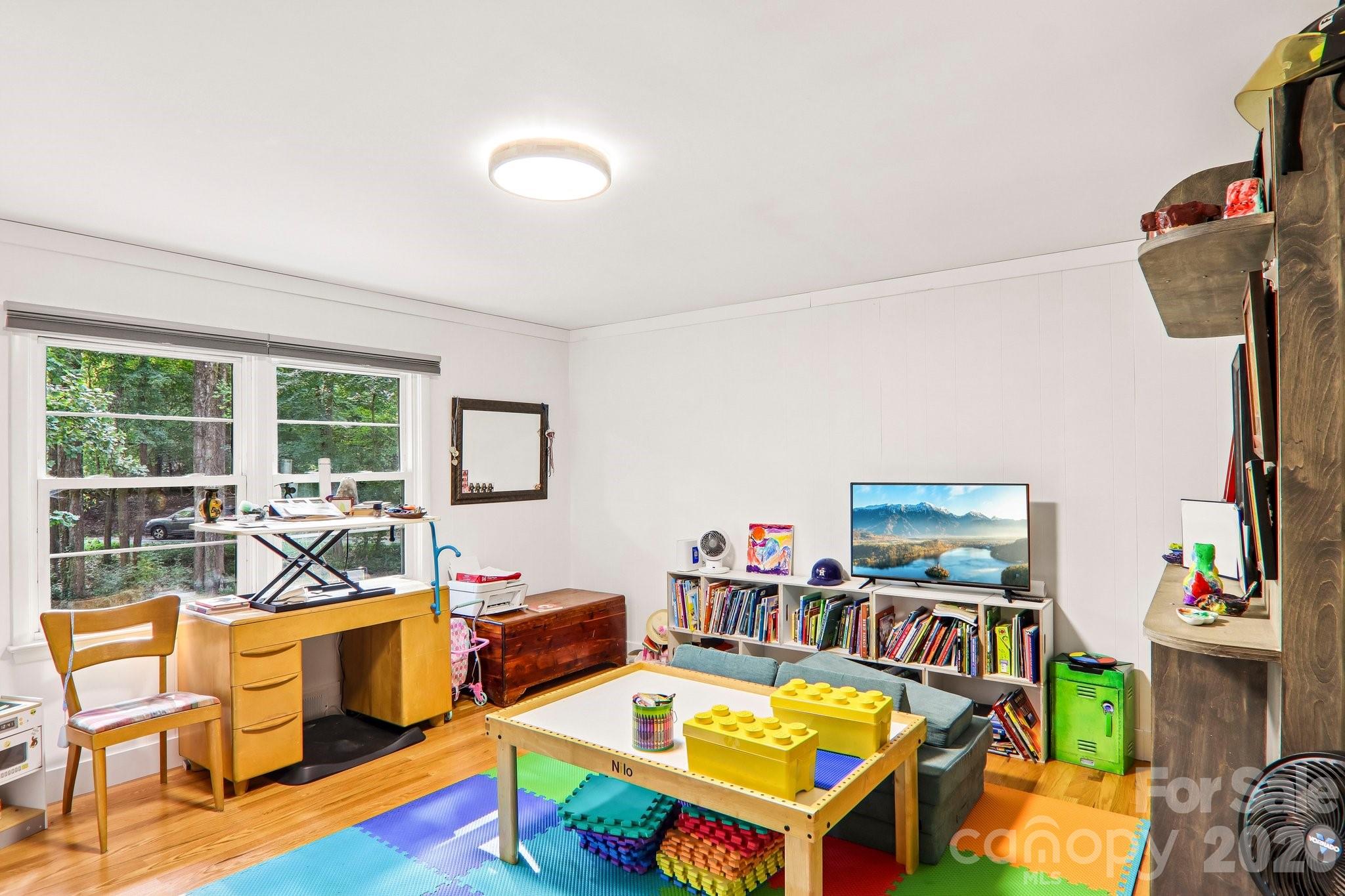 First of four bedrooms on the main level, currently being used as a play room. - 333 Kenilworth Road, Asheville