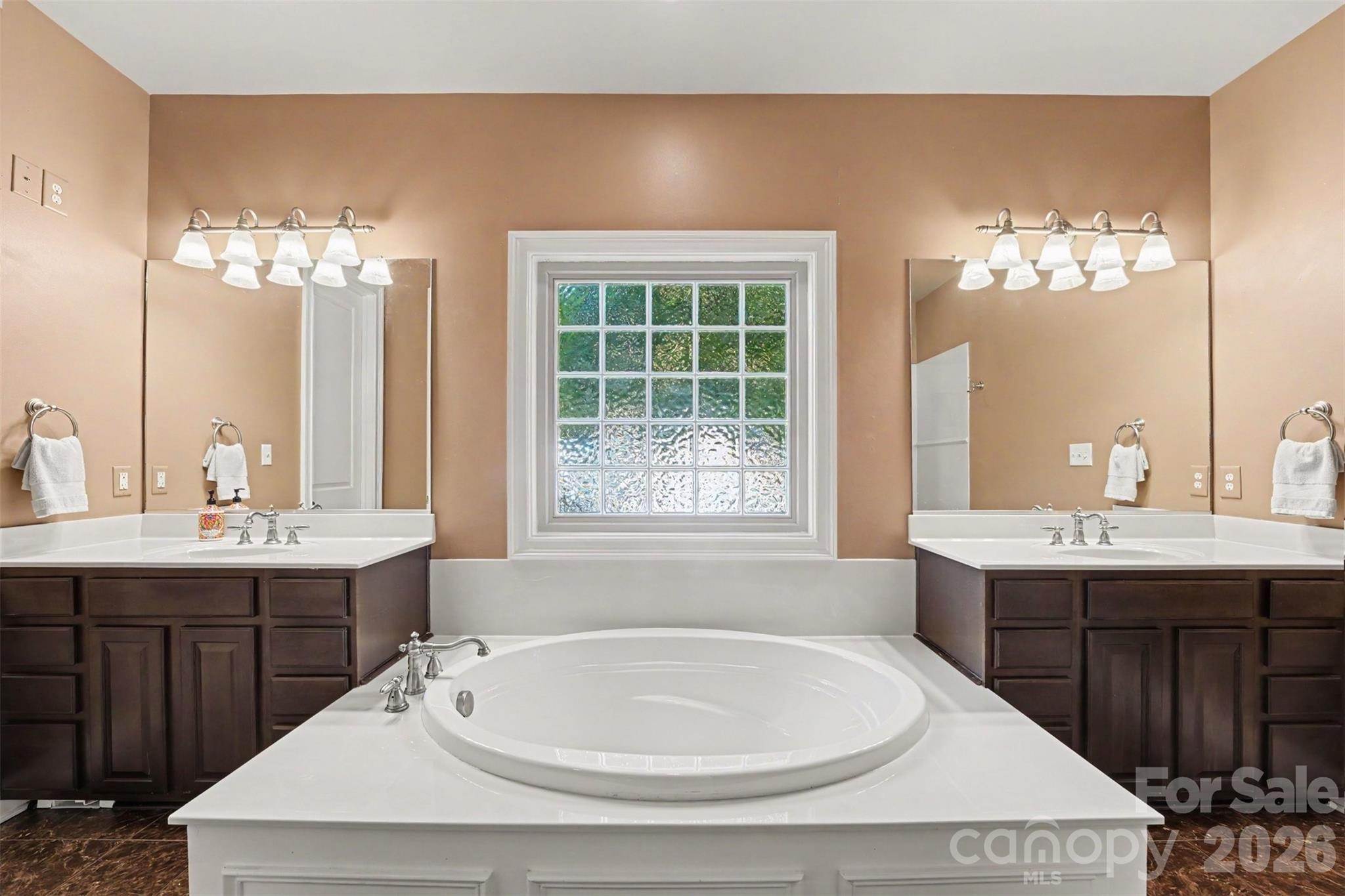 Primary bathroom with dual vanities and large walk in shower. - 120 Palos Verde Drive, Mooresville
