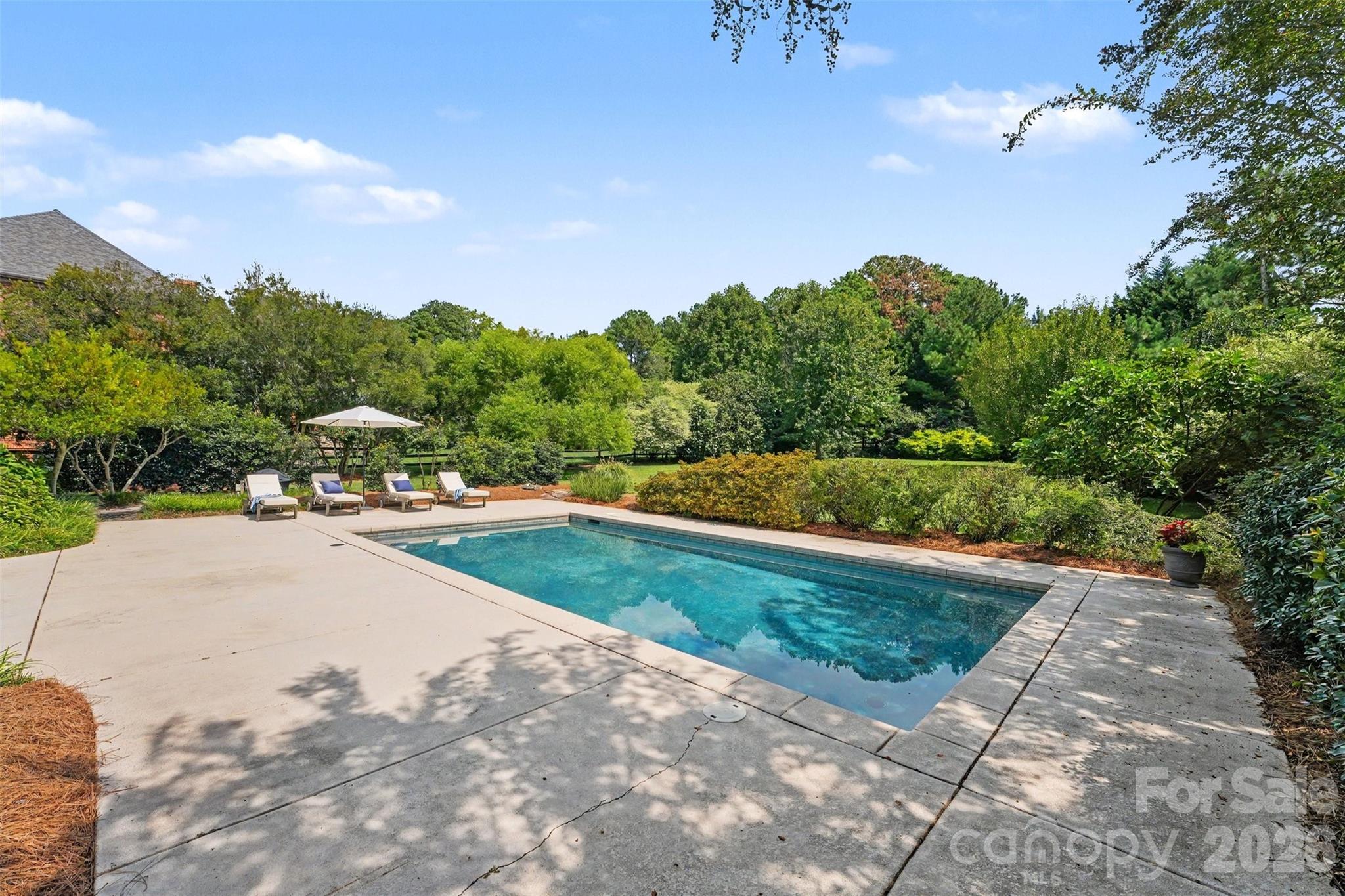 The pool is surrounded by cool decking to keep your feet from burning in the hot summer months. approximately 1,280 square feet of decking. - 120 Palos Verde Drive, Mooresville