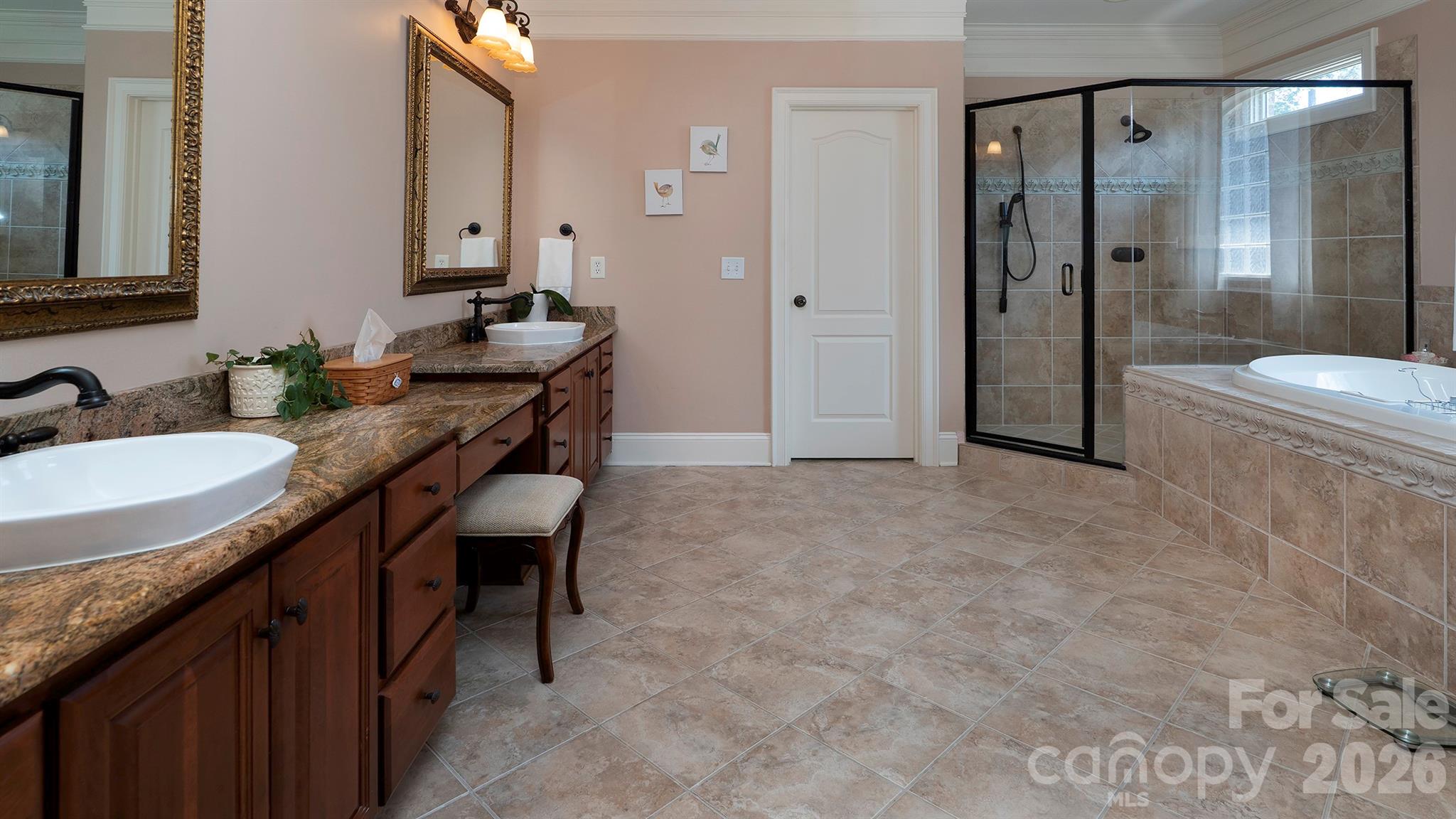 Primary bathroom with dual sinks... - 7786 Chapel Creek Drive, Denver