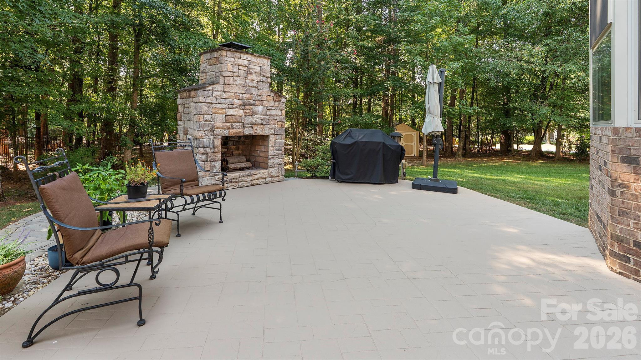 Beautiful patio with fireplace... - 7786 Chapel Creek Drive, Denver