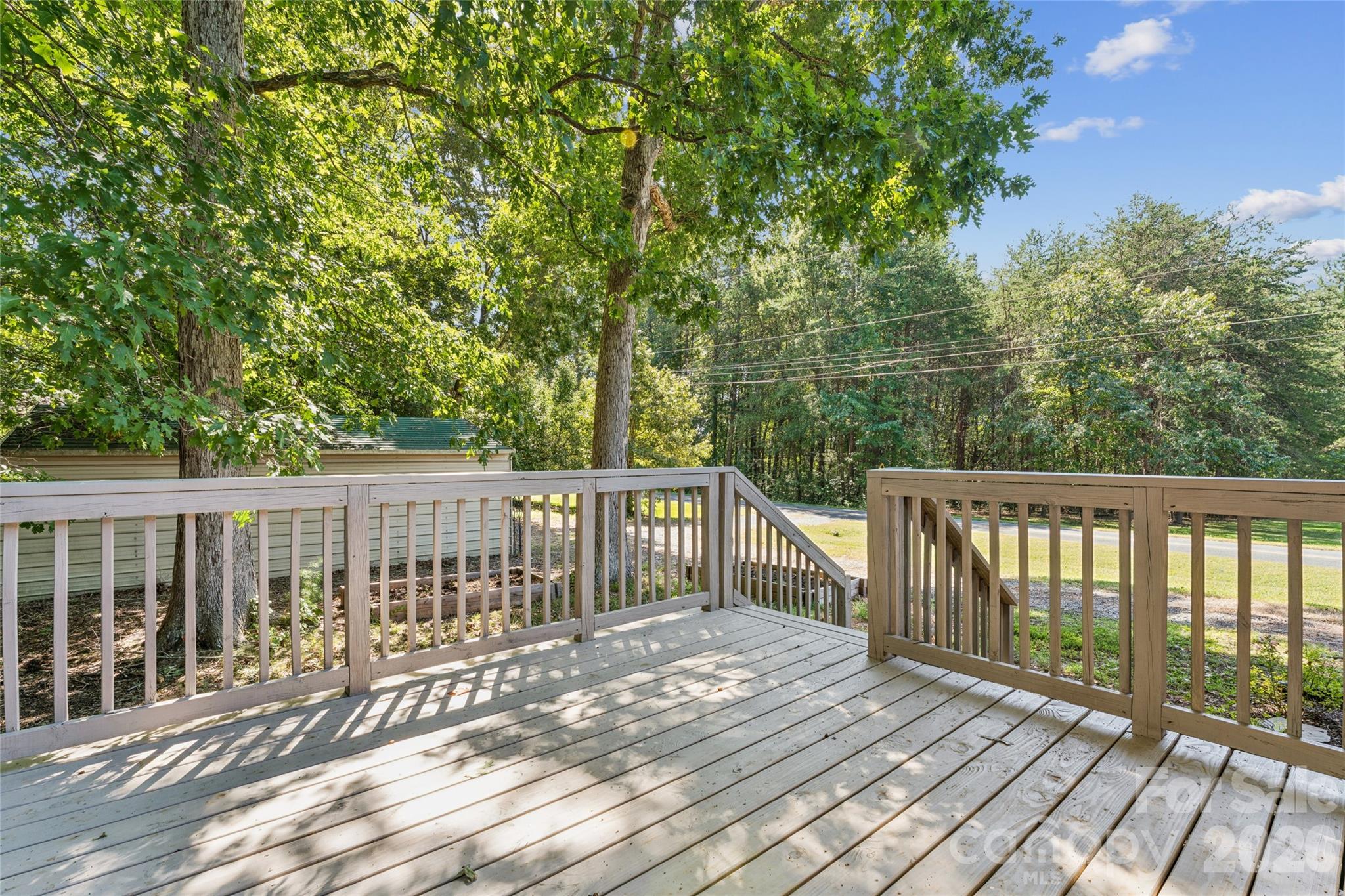 Enjoy entertaining on the spacious deck - 611 Woodland Drive, Rockwell