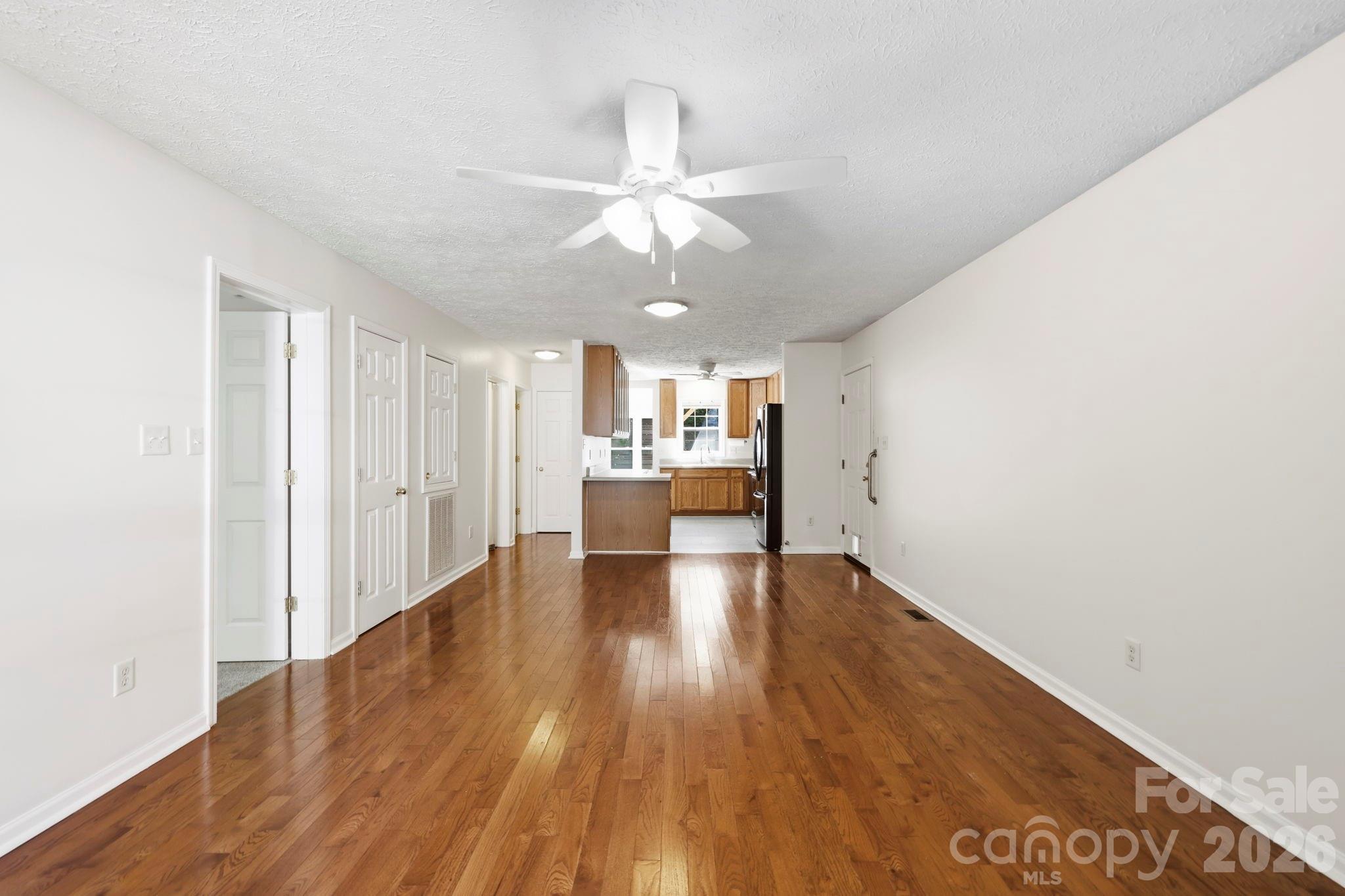 Open Living Room/ Dining/ Kitchen Area - 8A Bent Grass Court, Black Mountain