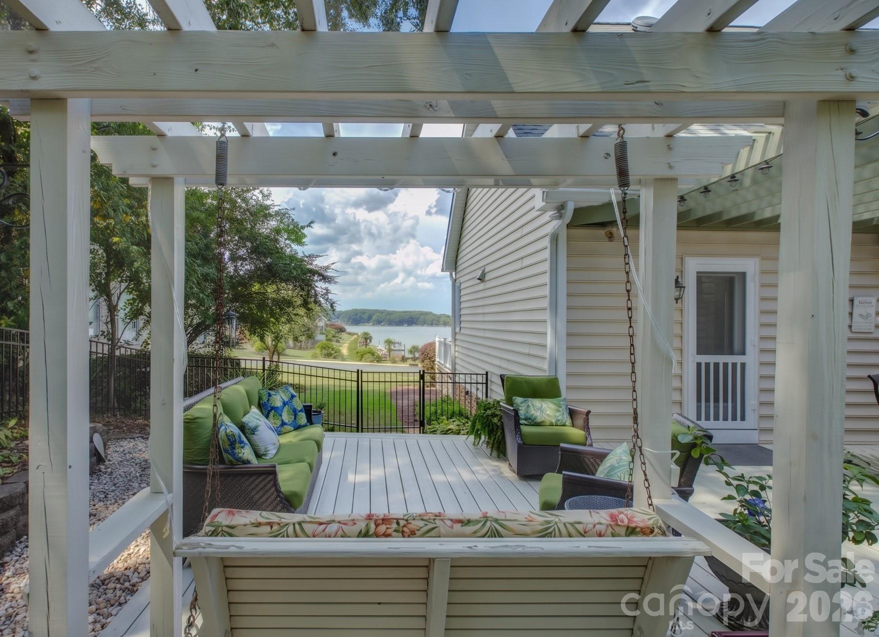 The rear porch swing offers an exceptional and scenic view of the lake. - 946 Lake Club Drive, Rock Hill