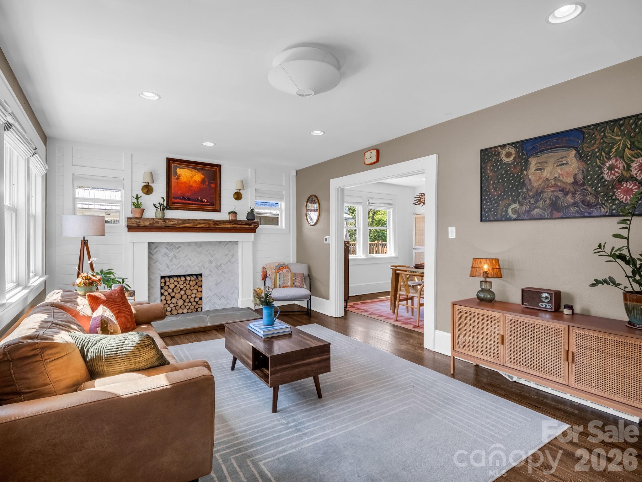 living room with tons of natural light and hard floors - 10 Dale Street, Asheville