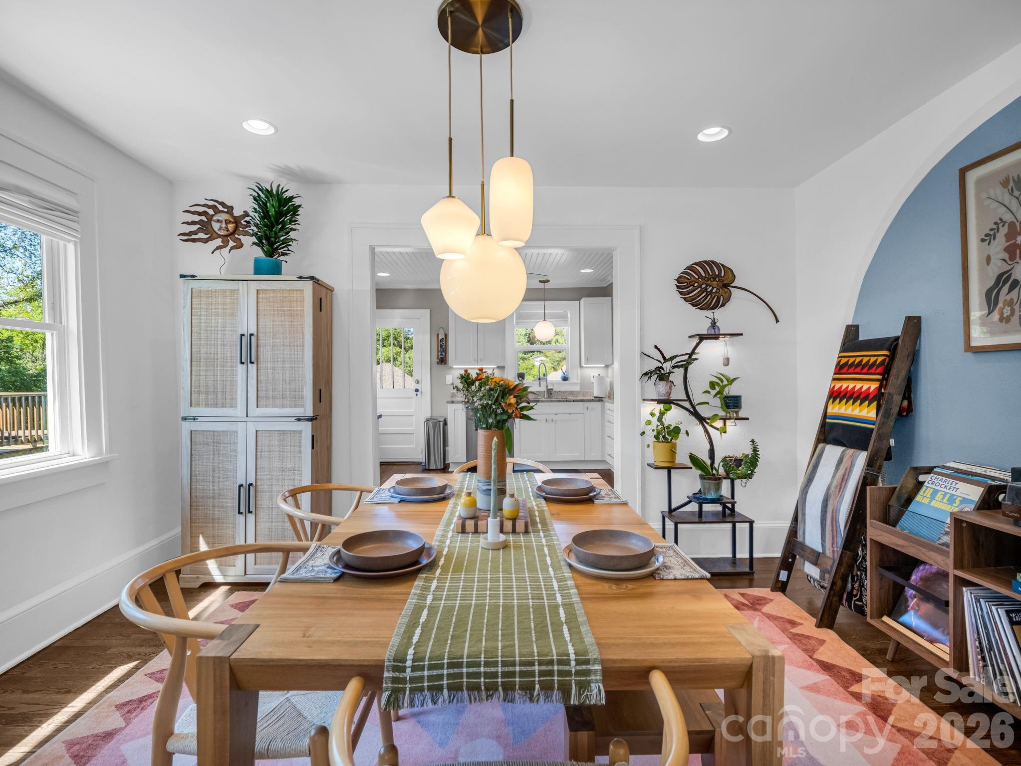 dining room with upgraded lighting, classic character, and tasteful updates - 10 Dale Street, Asheville