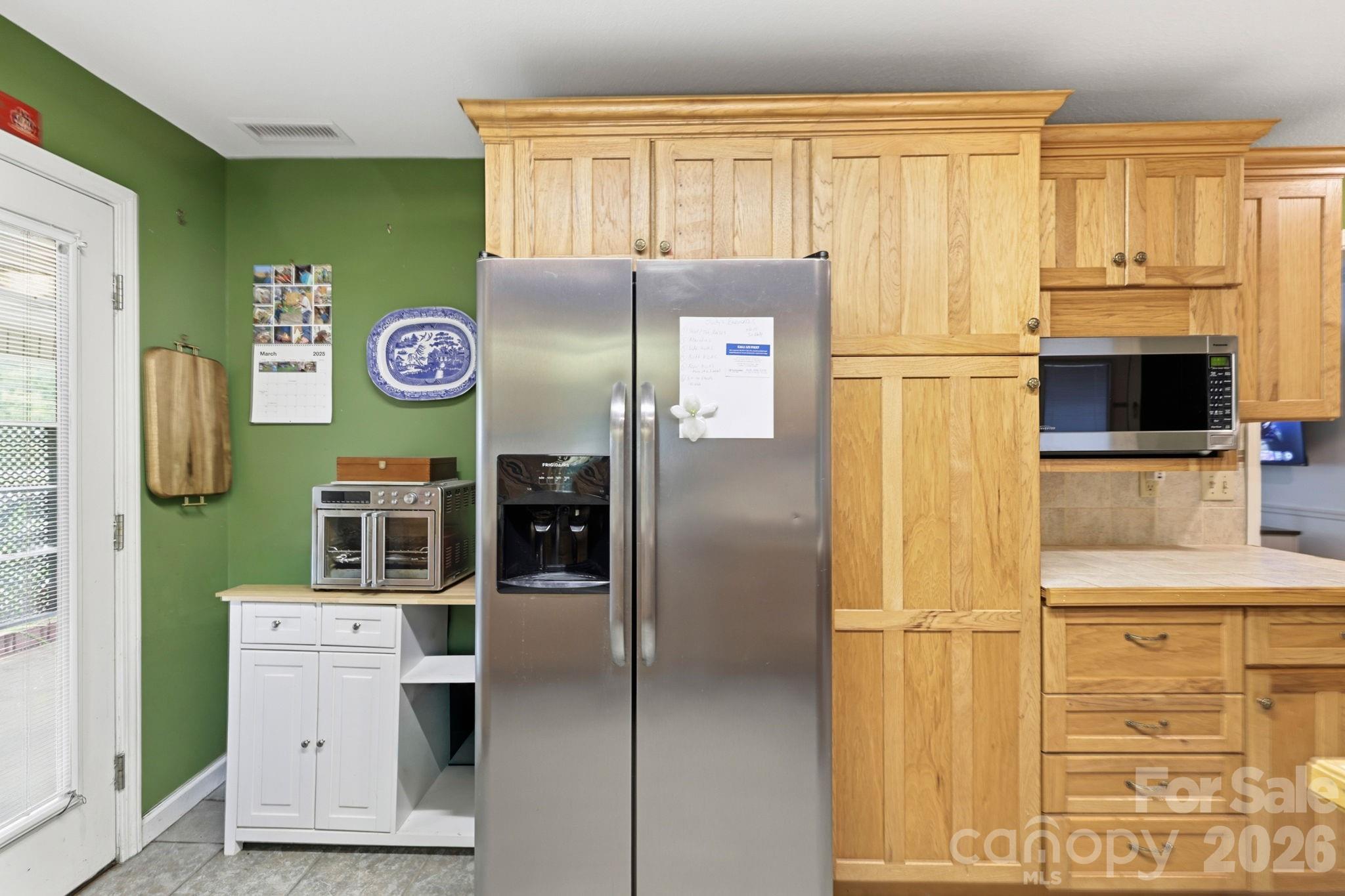 Refrigerator near door to carport - 10687 Cruso Road, Canton