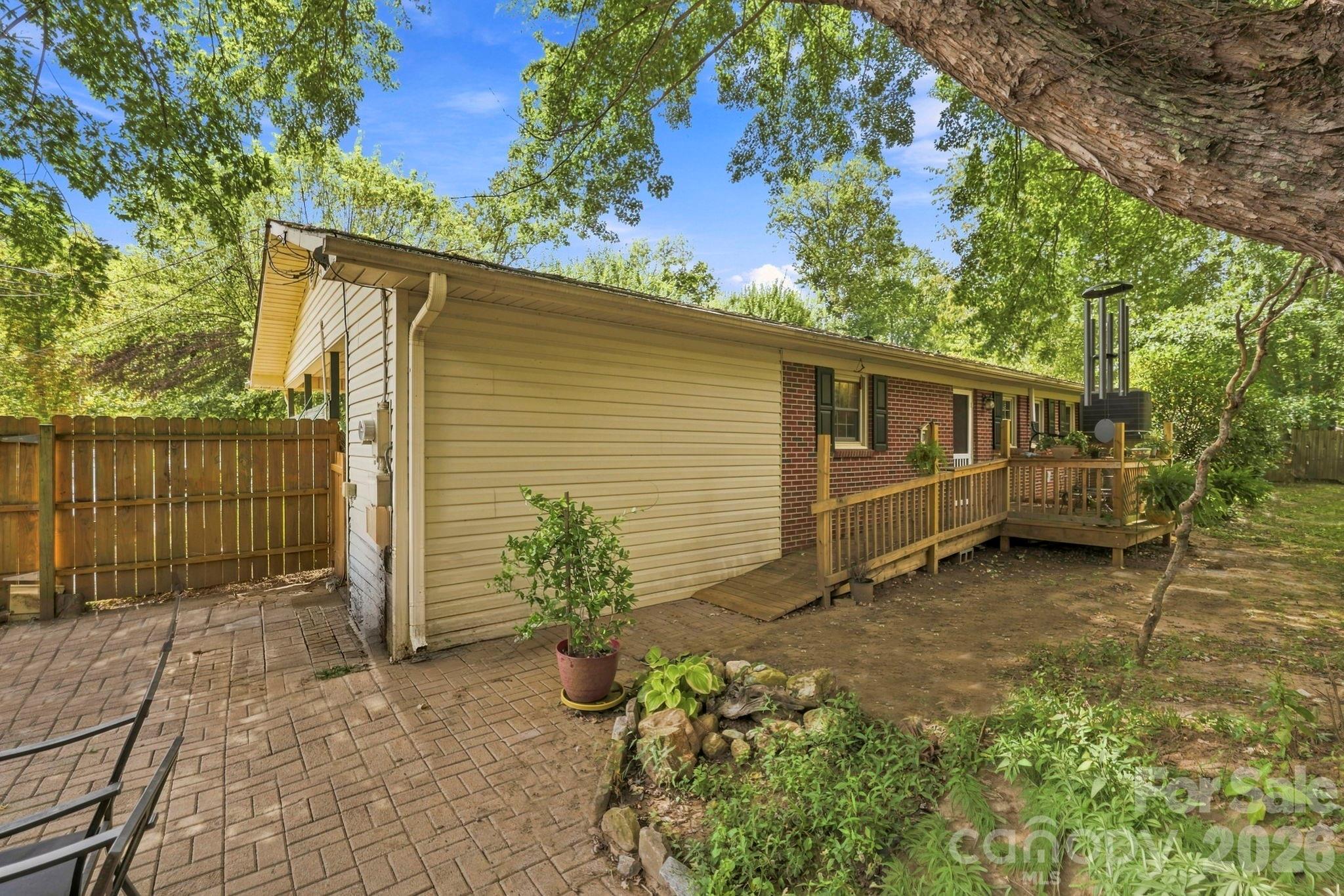 Back of house, brick patio - 10687 Cruso Road, Canton