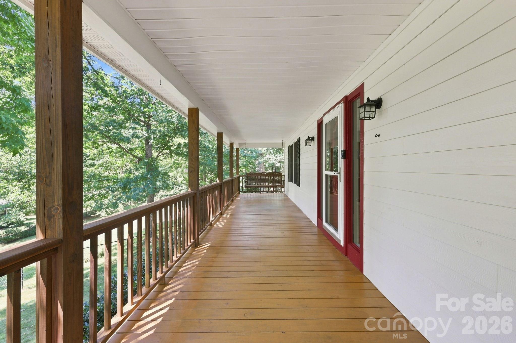 Expansive front porch with porch swing. - 95 Holly Ridge Road, Waynesville
