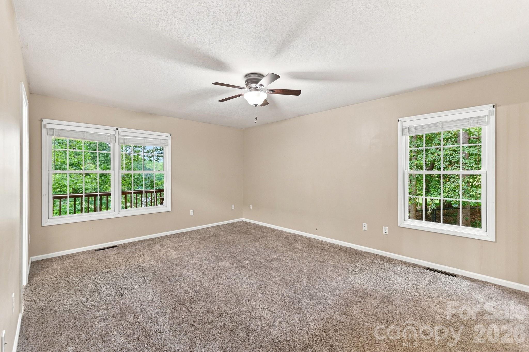 Primary Bedroom on the main level - 95 Holly Ridge Road, Waynesville
