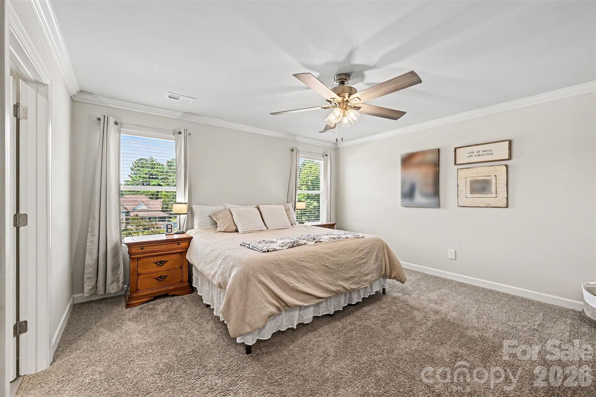The primary bedroom is on the second floor. Neutral paint and flooring colors continue upstairs. - 408 Luna Lane, Shelby