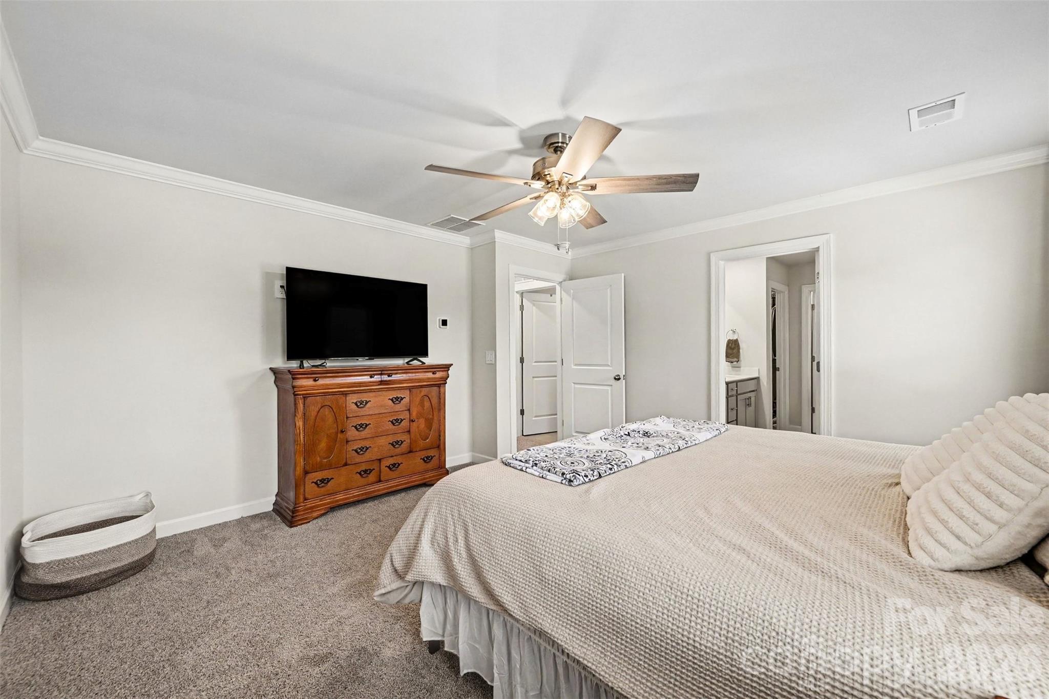 There is an ensuite bath in the primary. - 408 Luna Lane, Shelby